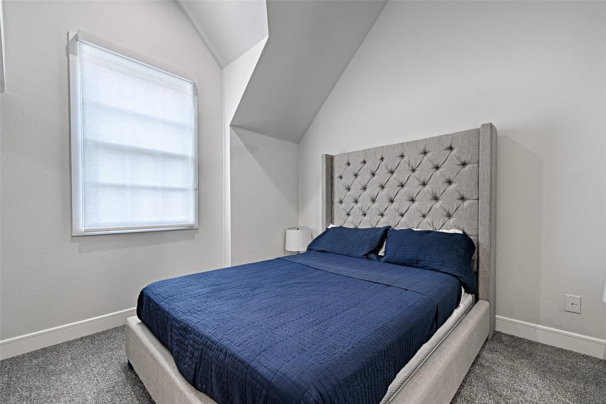 Recessed window with white blinds