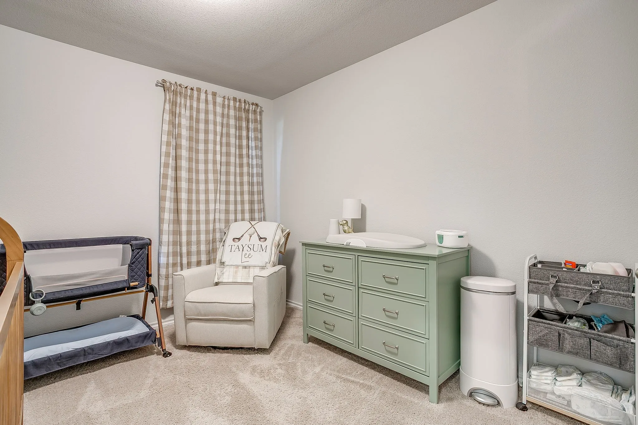 Plush carpet flooring complements light-toned walls