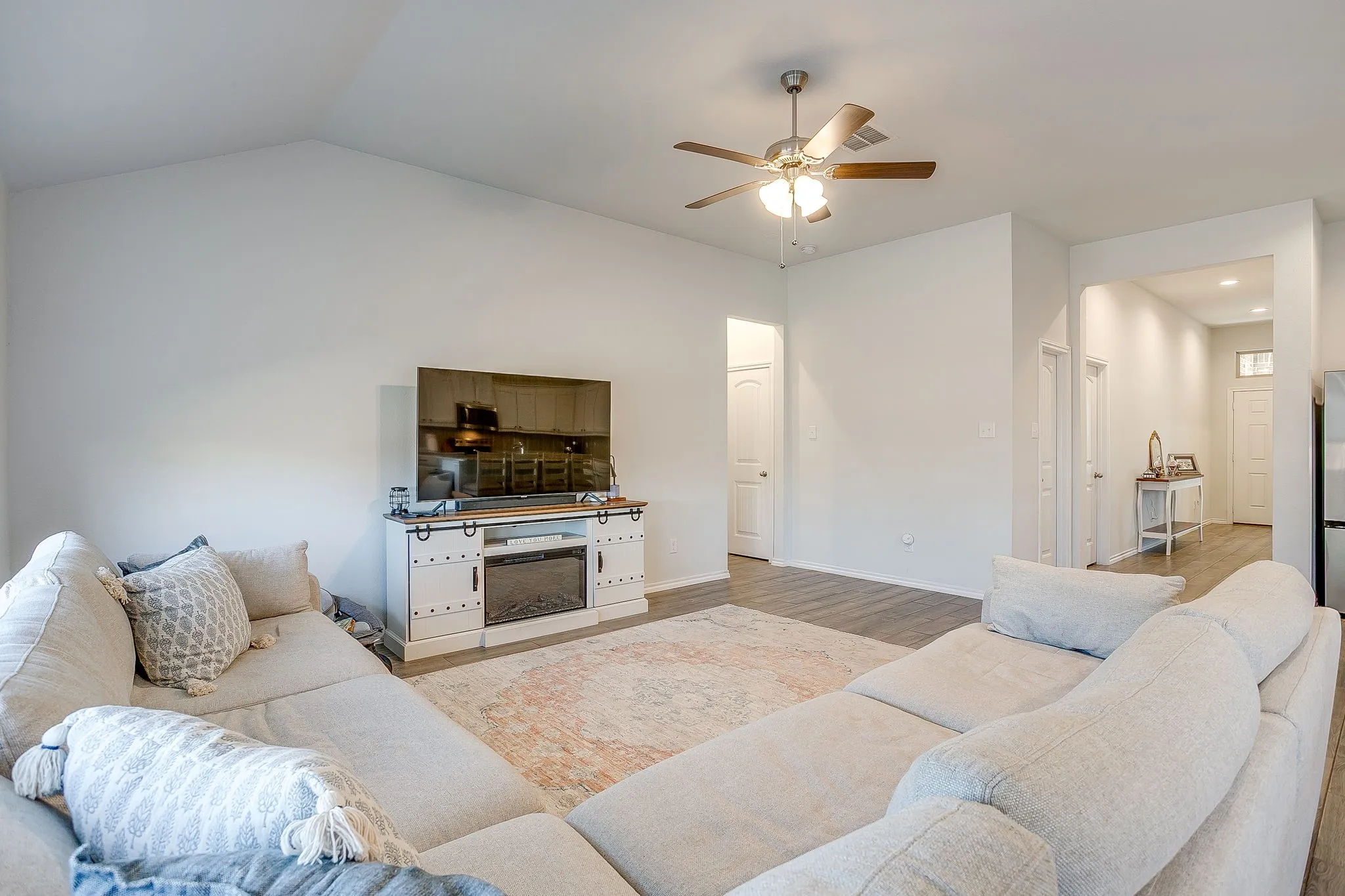 Vaulted ceilings complement the wood-finish flooring