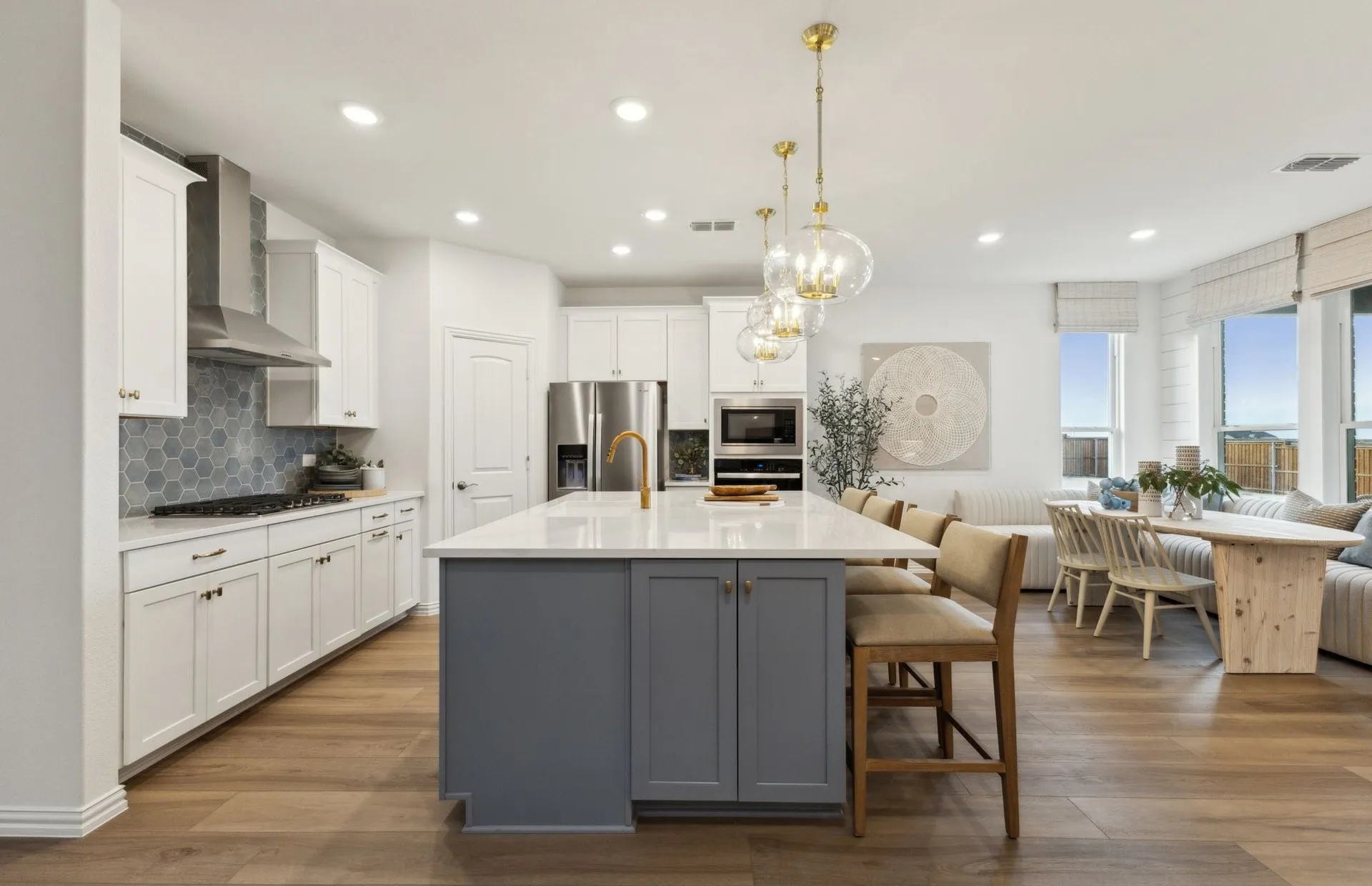 *Model Representation - Large island overlooking gathering room and dining areas