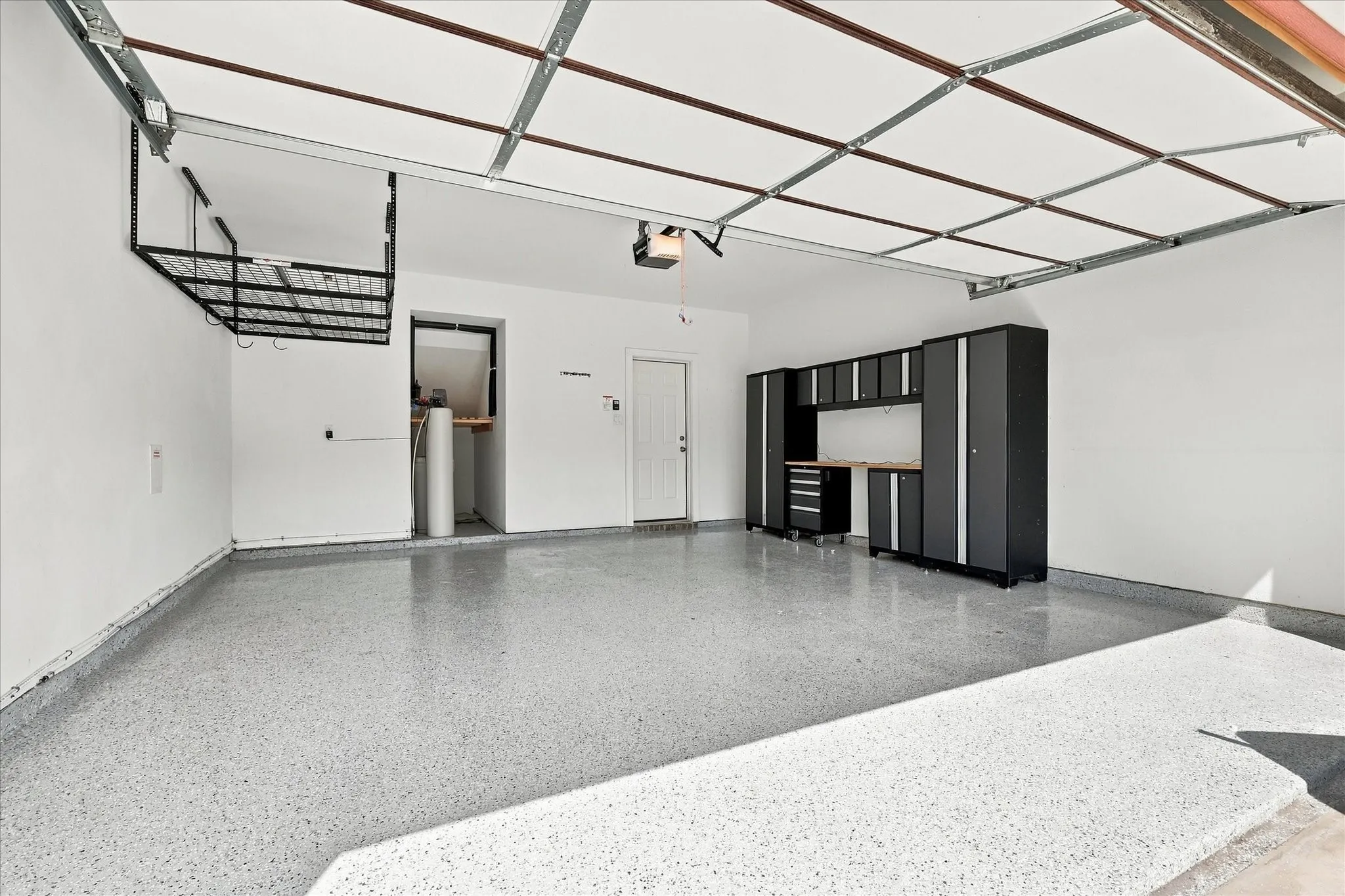 Garage with epoxy floors and storage