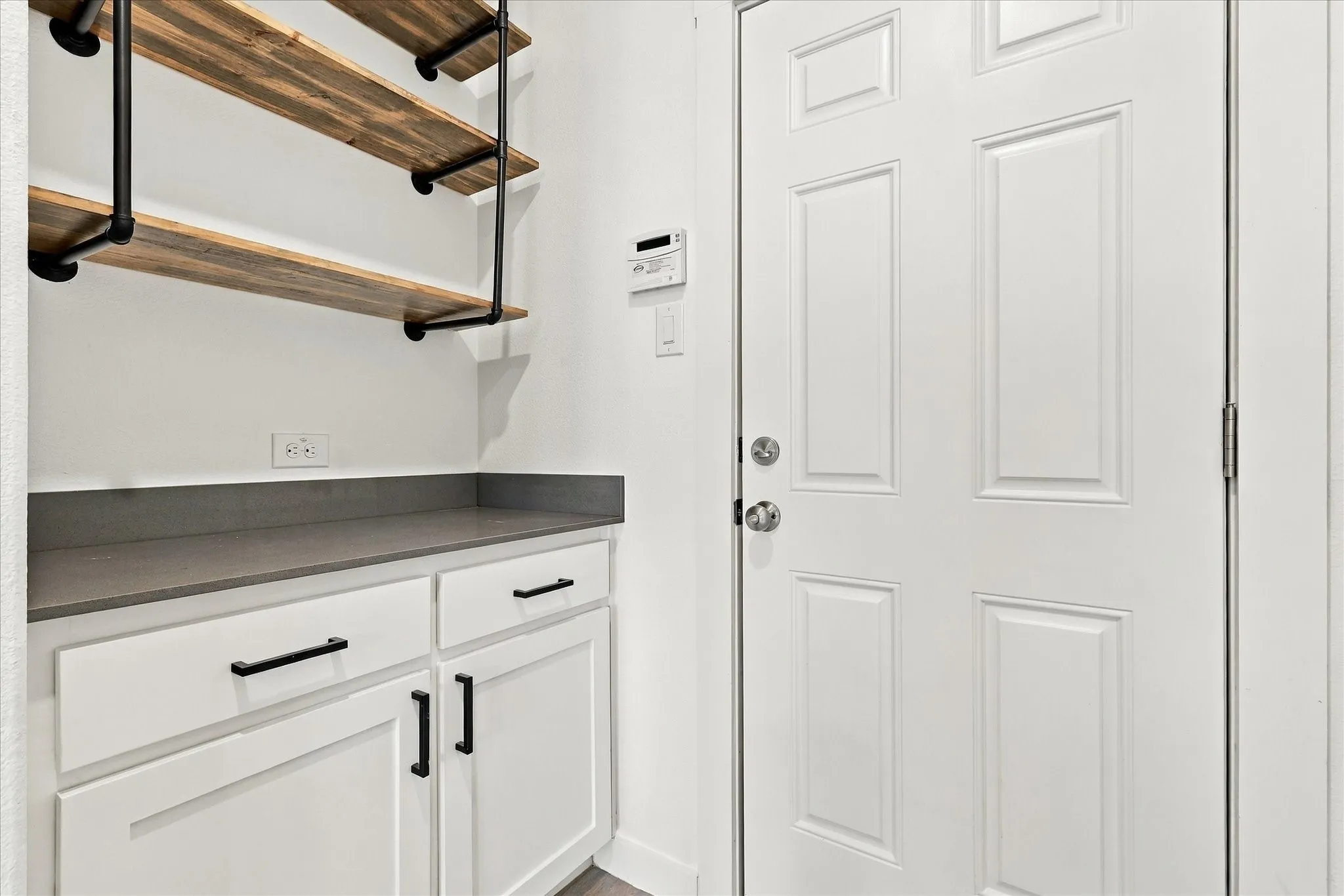 Functional drop zone with built-in storage conveniently located just off the garage