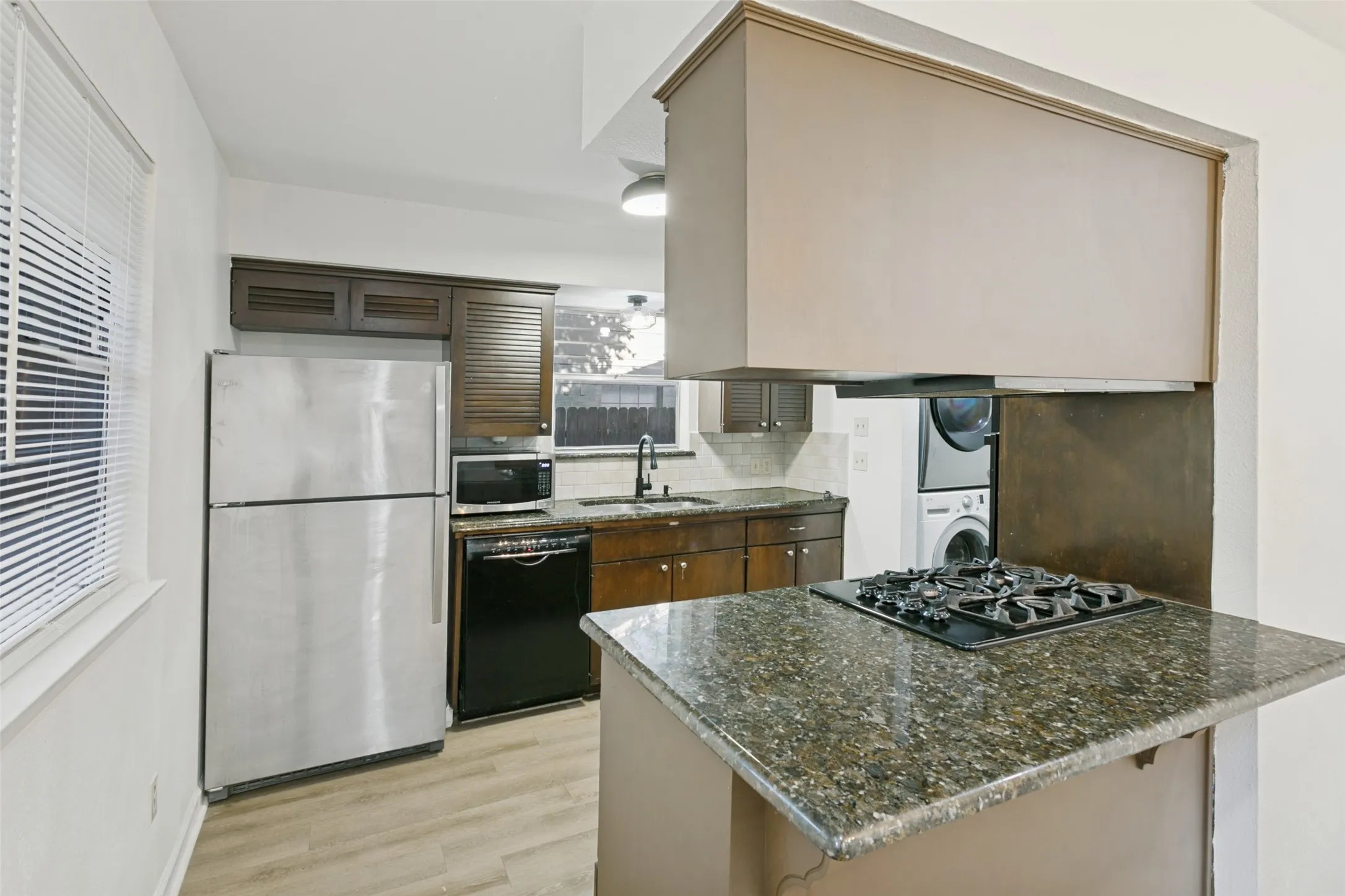 Refrigerator included in sale.