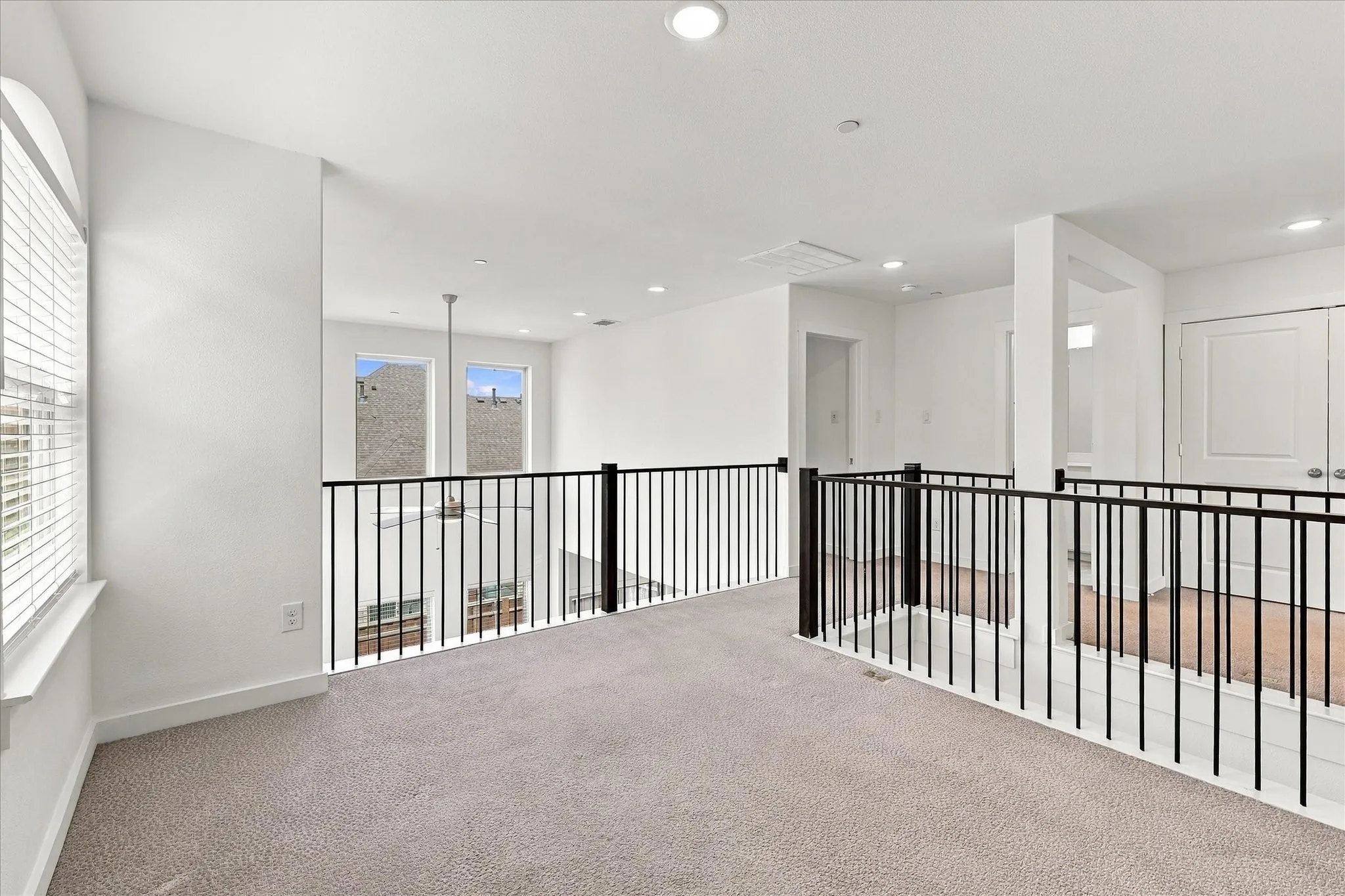 Versatile upstairs game room offers additional space to relax, play or entertain