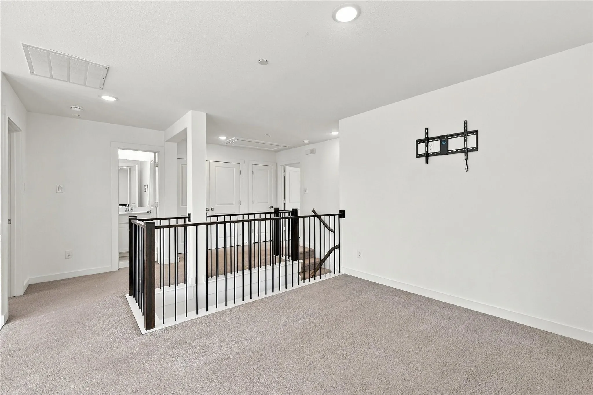 Open game room overlooking the two-story living area below