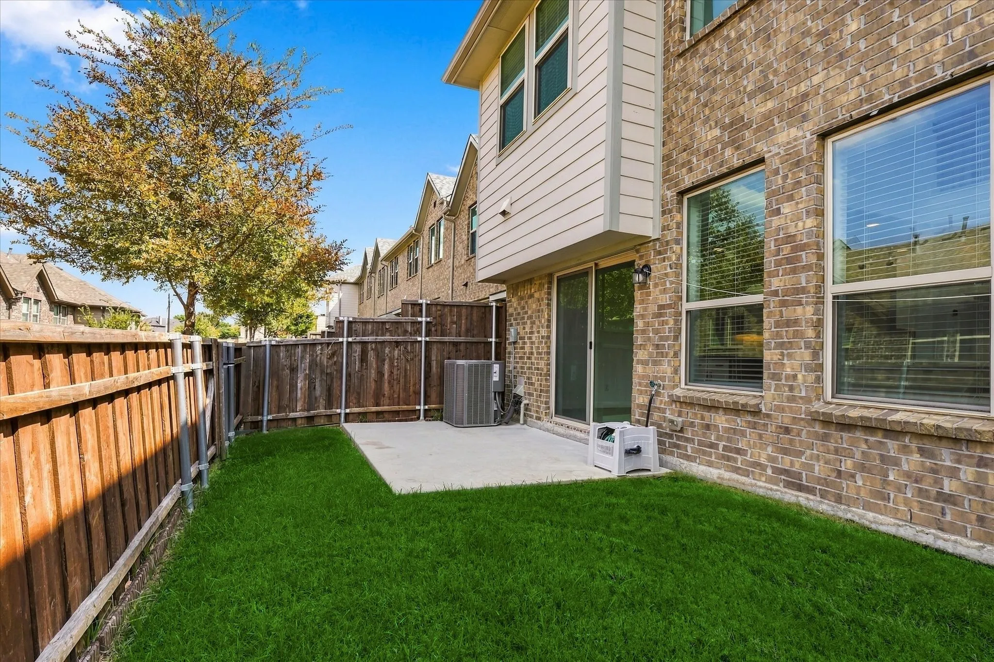 Low-maintenance backyard offers the perfect spot for relaxing, grilling or entertaining