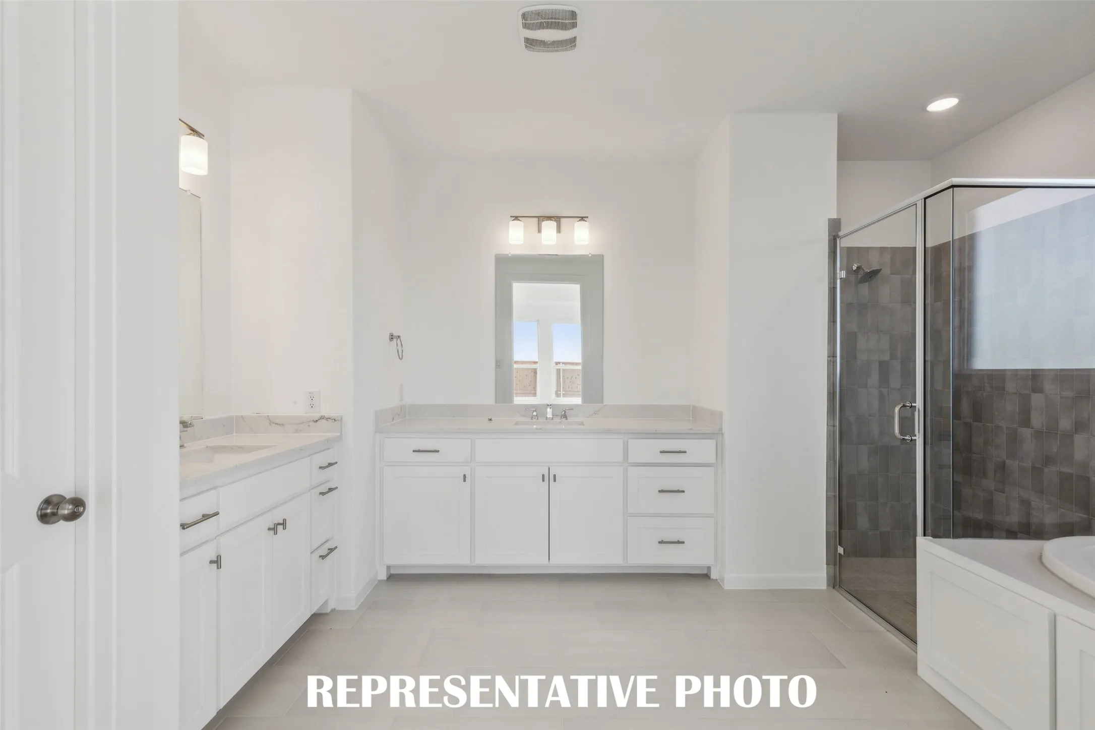 This owner's bath was designed with ample space for two!  REPRESENTATIVE PHOTO