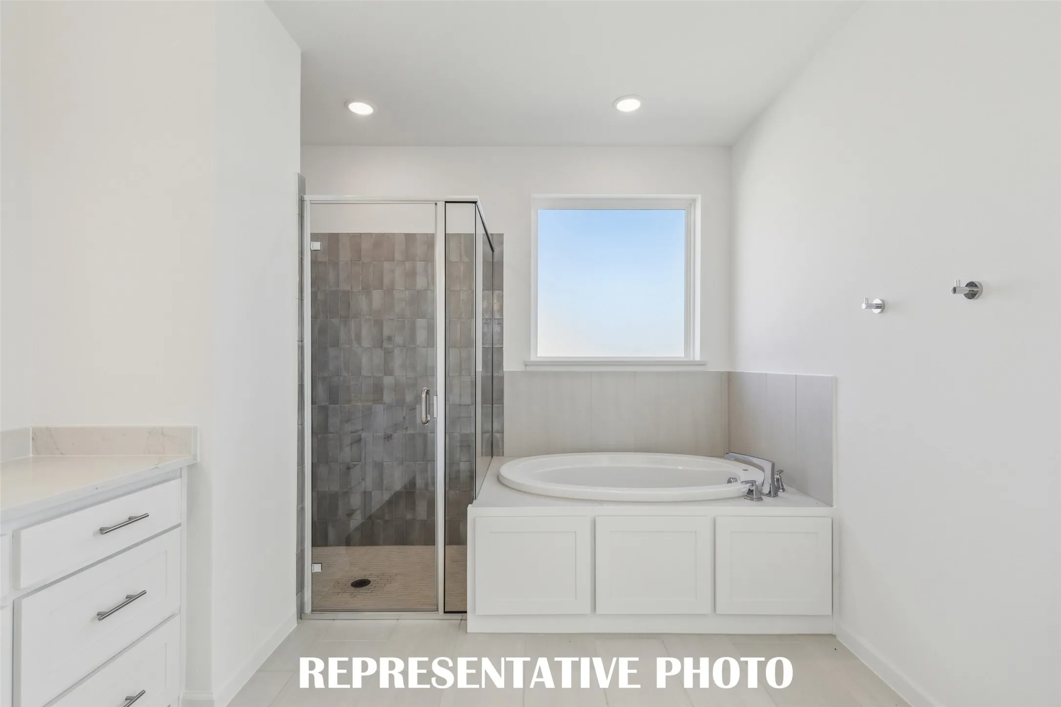 Whether it's soaking your cares away or taking a long, luxurious shower, this owner's bath is the perfect place to start or end your day!  REPRESENTATIVE PHOTO