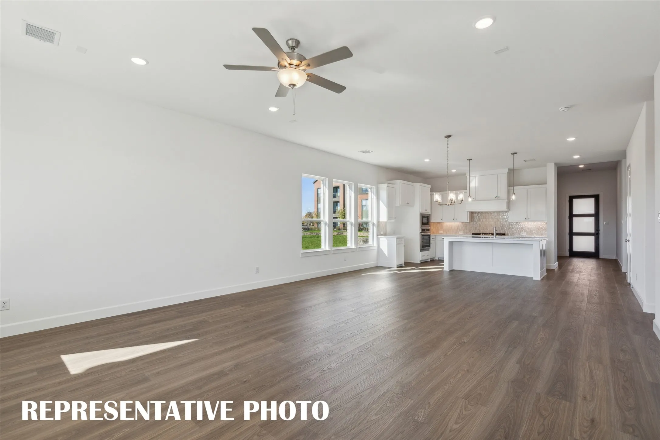 The chef will never be left out of the party in this fantastic open concept home!  REPRESENTATIVE PHOTO