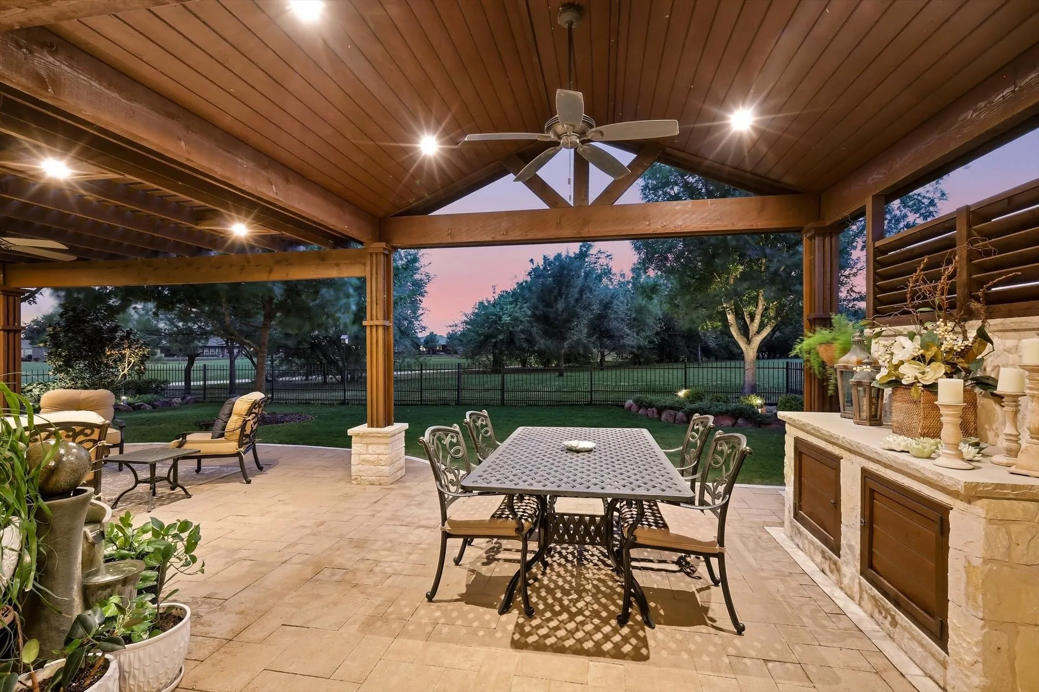 Priviate Extended patio featuring a gabled wood-finish ceiling with exposed beams, and paver flooring. Great for entertaining.