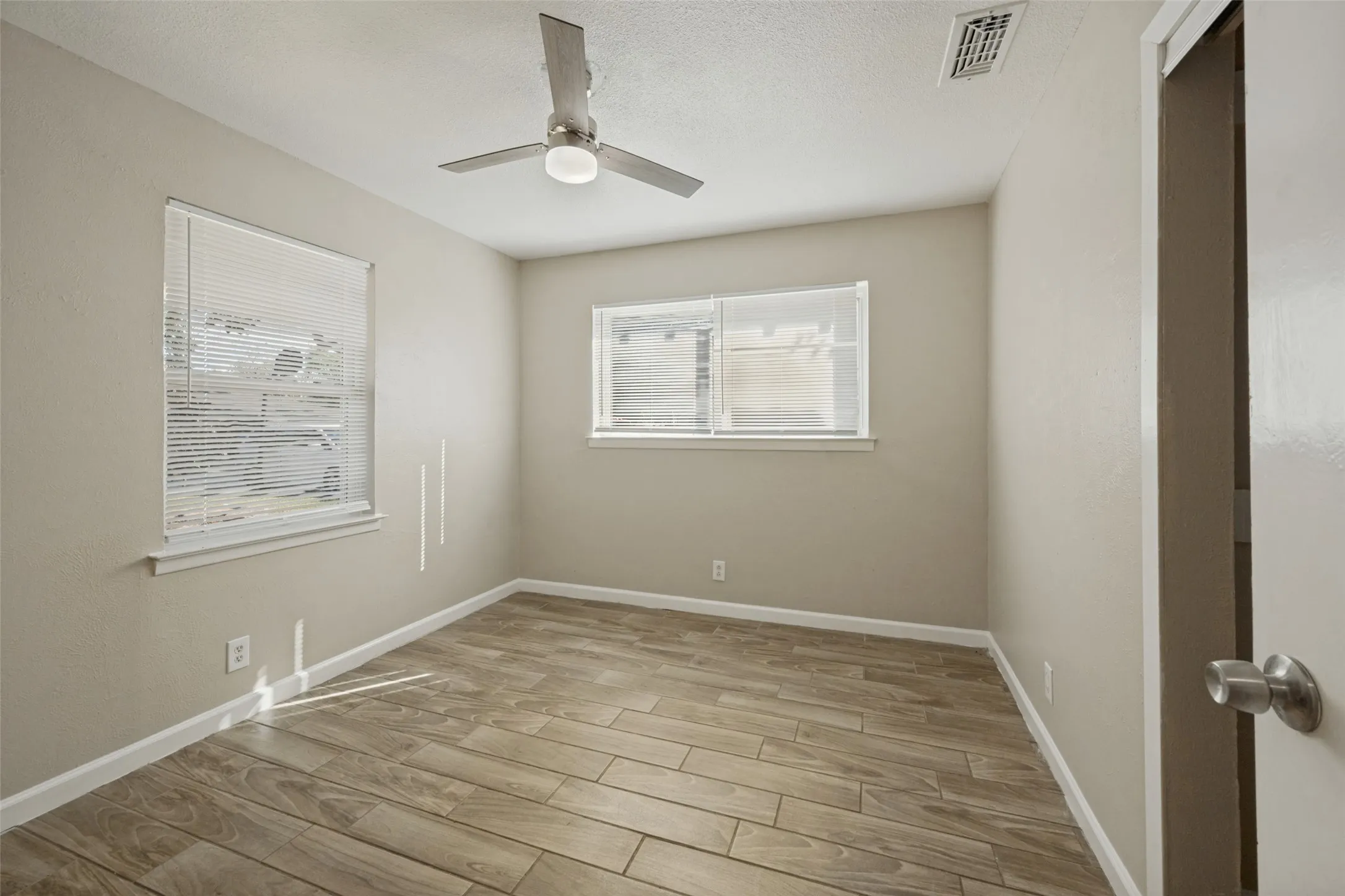 Wood-finish flooring with neutral wall tones