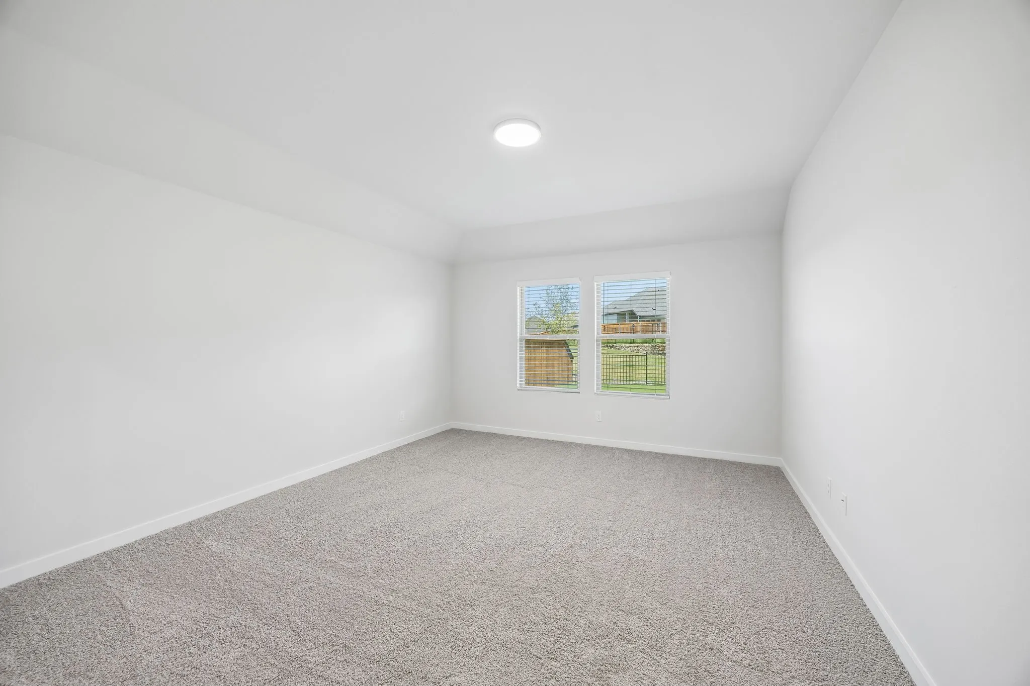 Primary bedroom in the Heisman home plan by Trophy Signature Homes – REPRESENTATIVE PHOTO