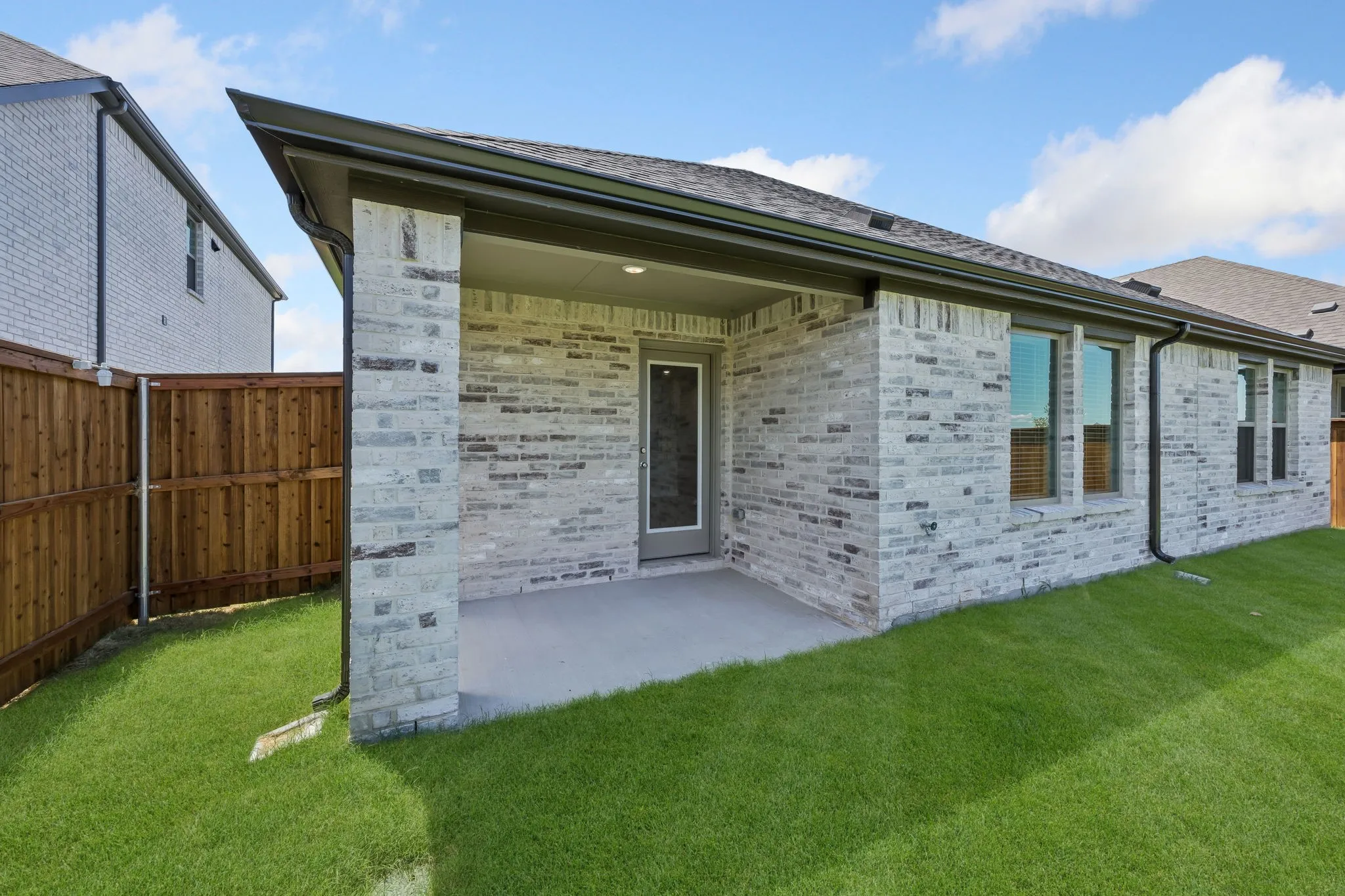 Covered patio in the Heisman home plan by Trophy Signature Homes – REPRESENTATIVE PHOTO