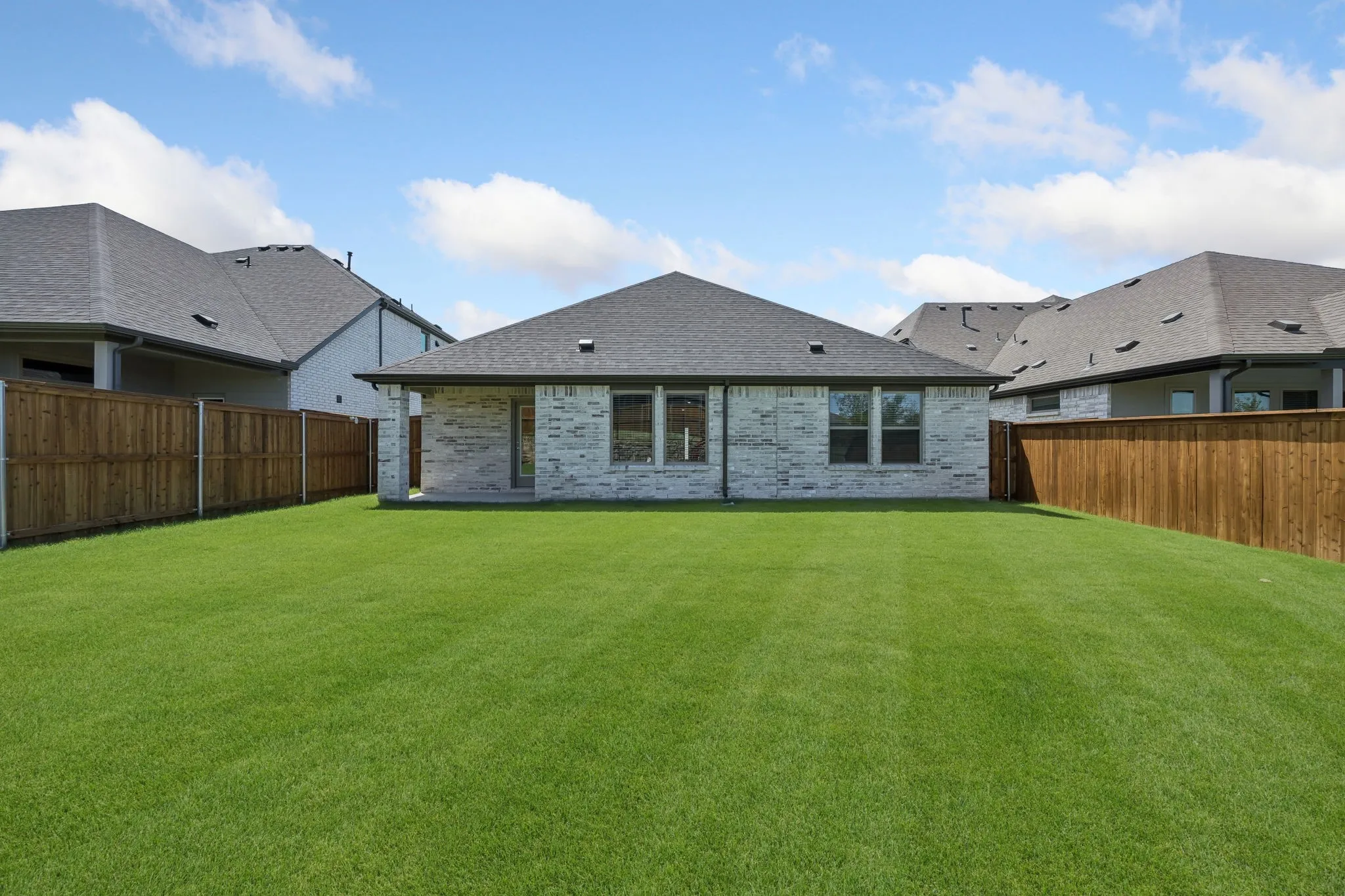 Covered patio in the Heisman home plan by Trophy Signature Homes – REPRESENTATIVE PHOTO