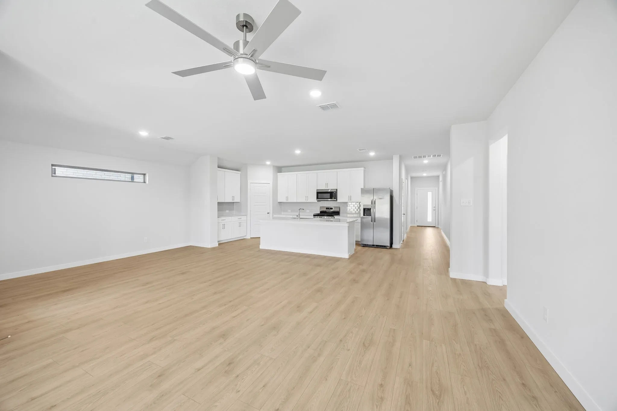 Open concept in the Heisman home plan by Trophy Signature Homes – REPRESENTATIVE PHOTO