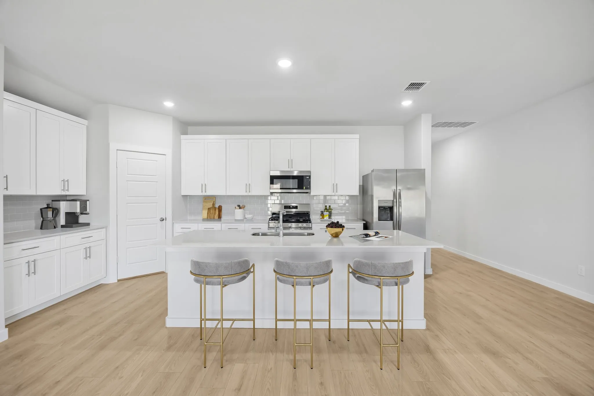 Kitchen in the Heisman home plan by Trophy Signature Homes – REPRESENTATIVE PHOTO