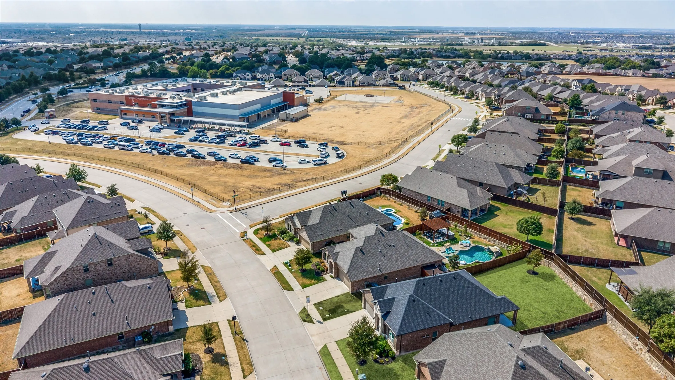 Residential community featuring a variety of single-family homes with fenced backyards