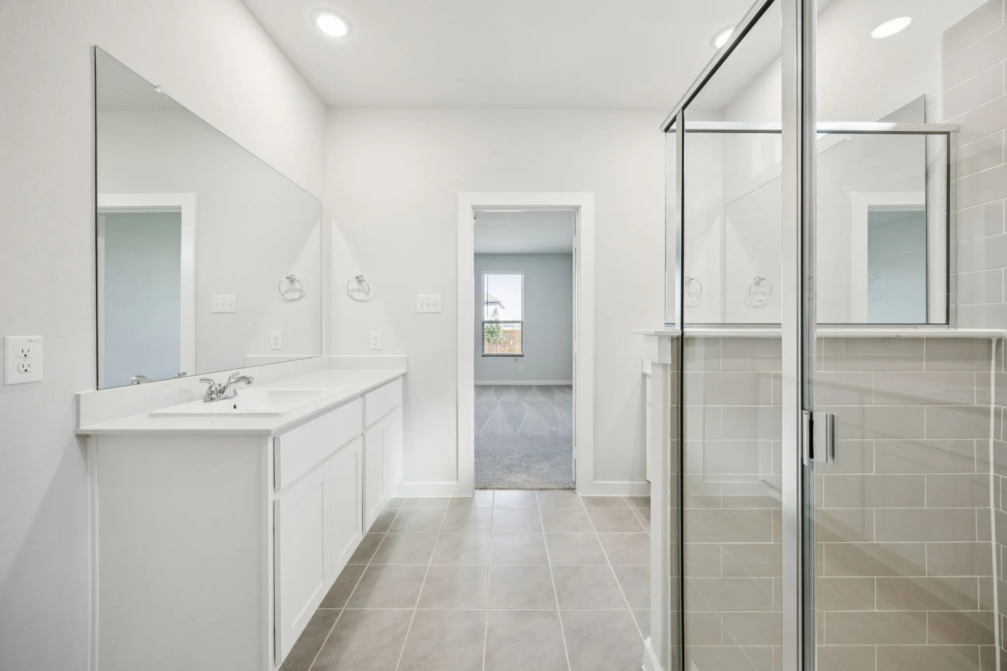 Primary Bathroom in the Masters home plan by Trophy Signature Homes – REPRESENTATIVE PHOTO