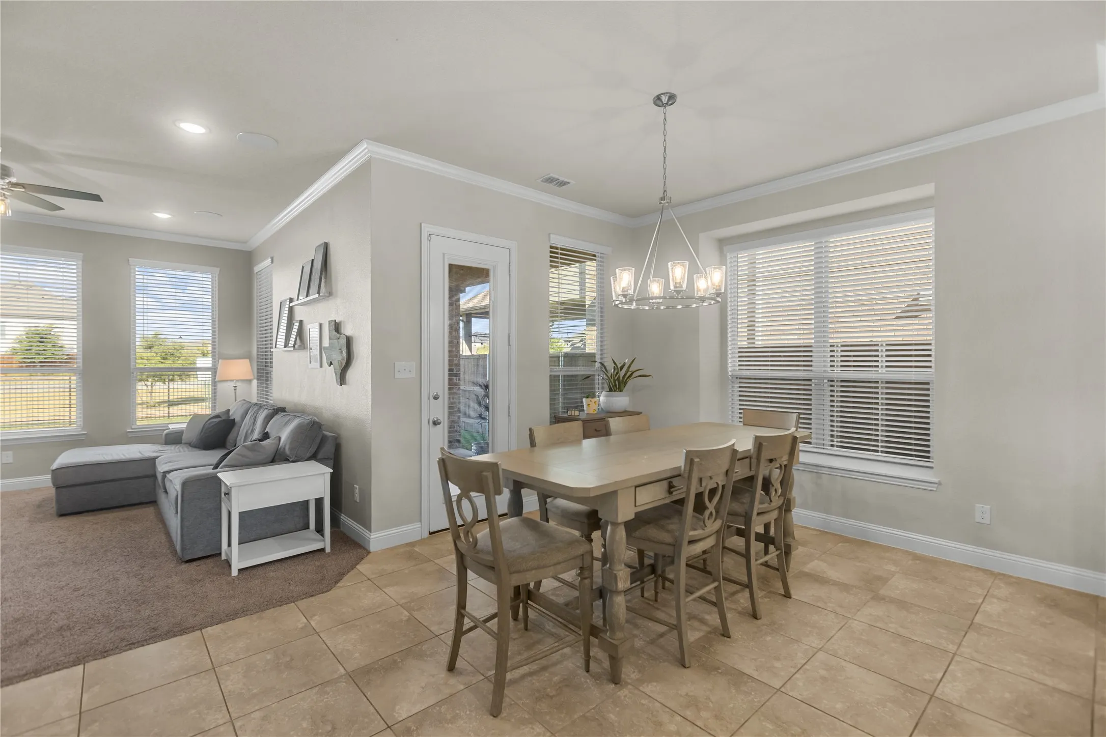 Bright dining area filled with natural light and seamlessly connected to the kitchen, perfect for everyday dining and entertaining.