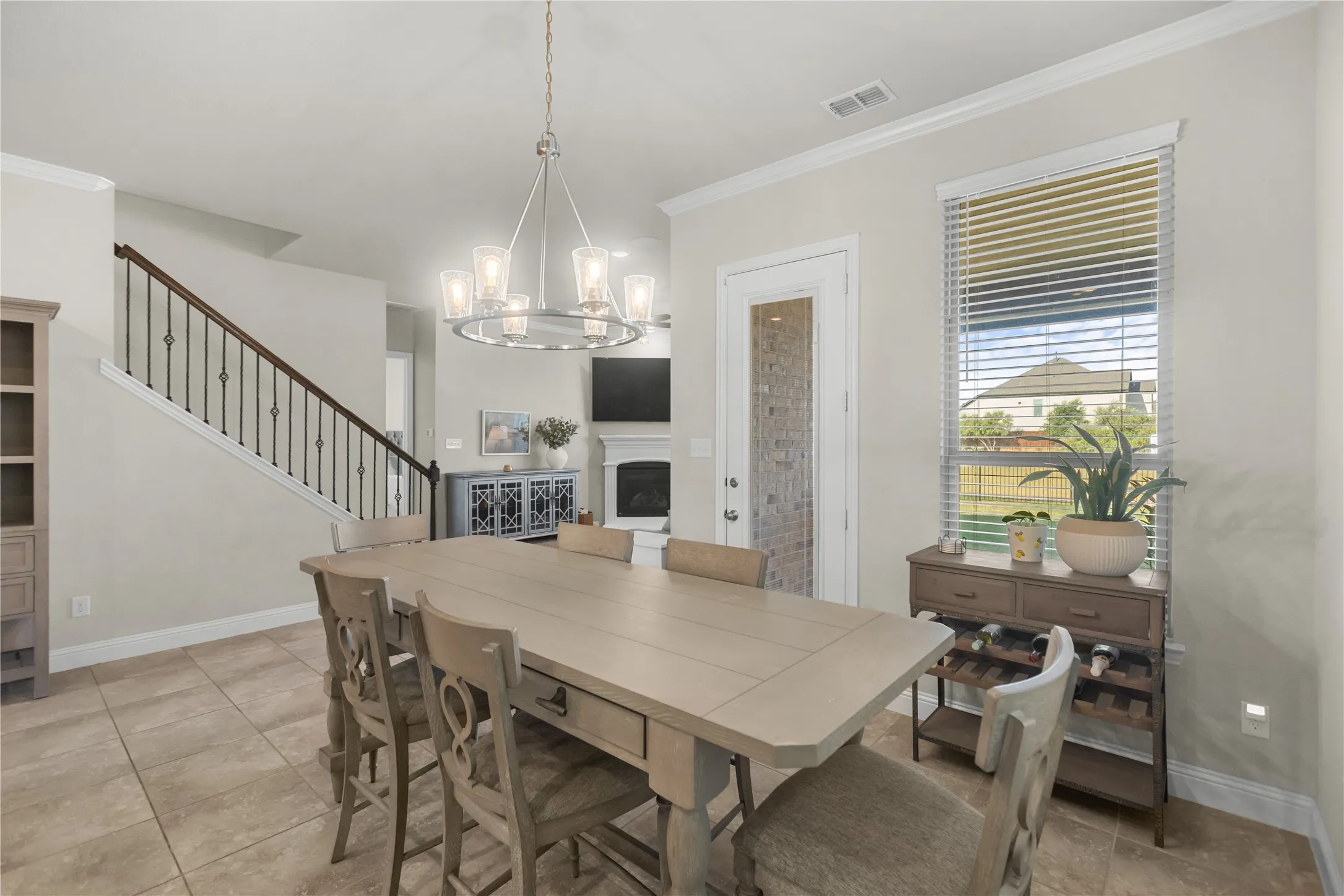 Tiled dining area conveniently located off the kitchen, creating the perfect space for year-round dining and entertaining.