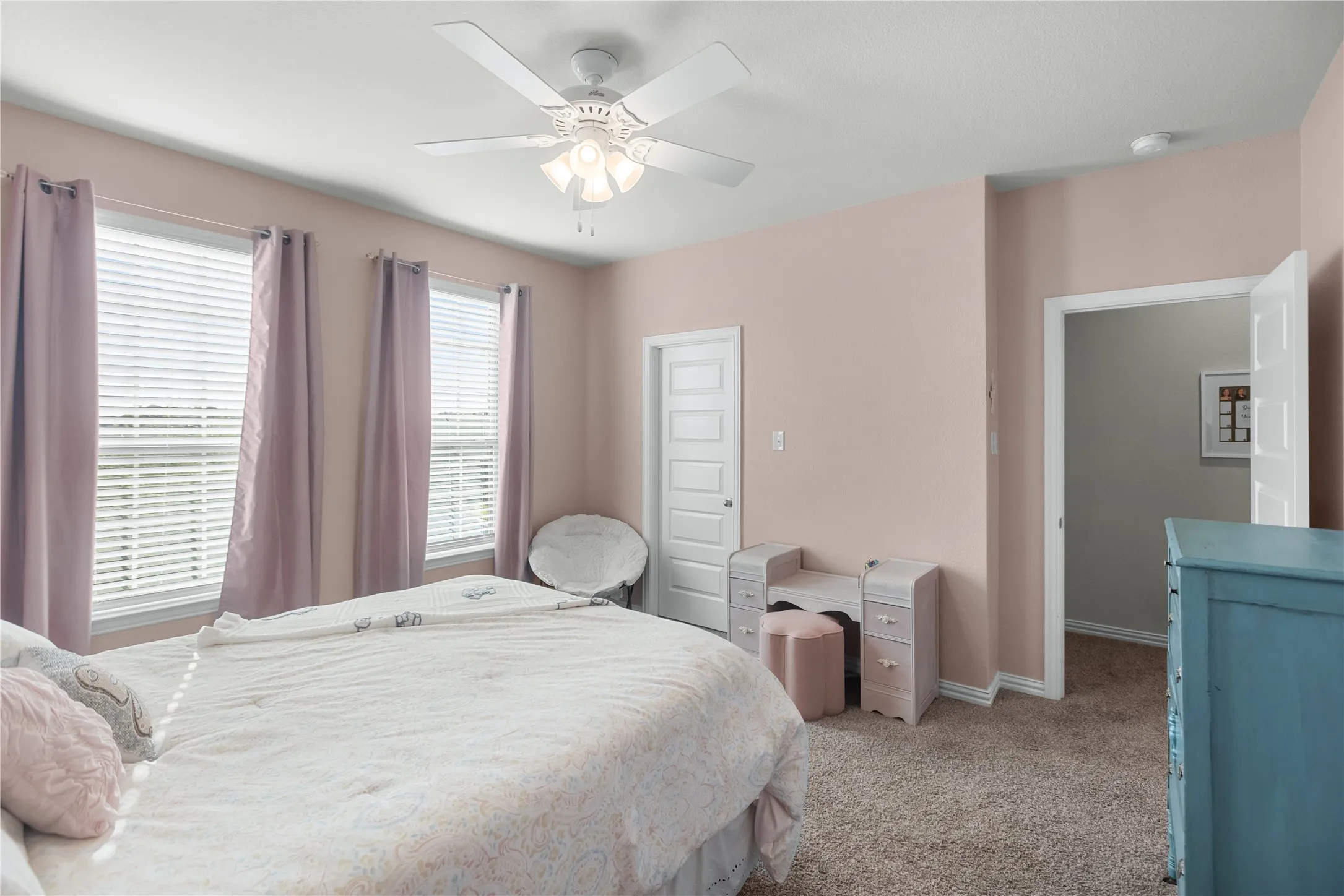 Upstairs bedroom with a walk-in closet.