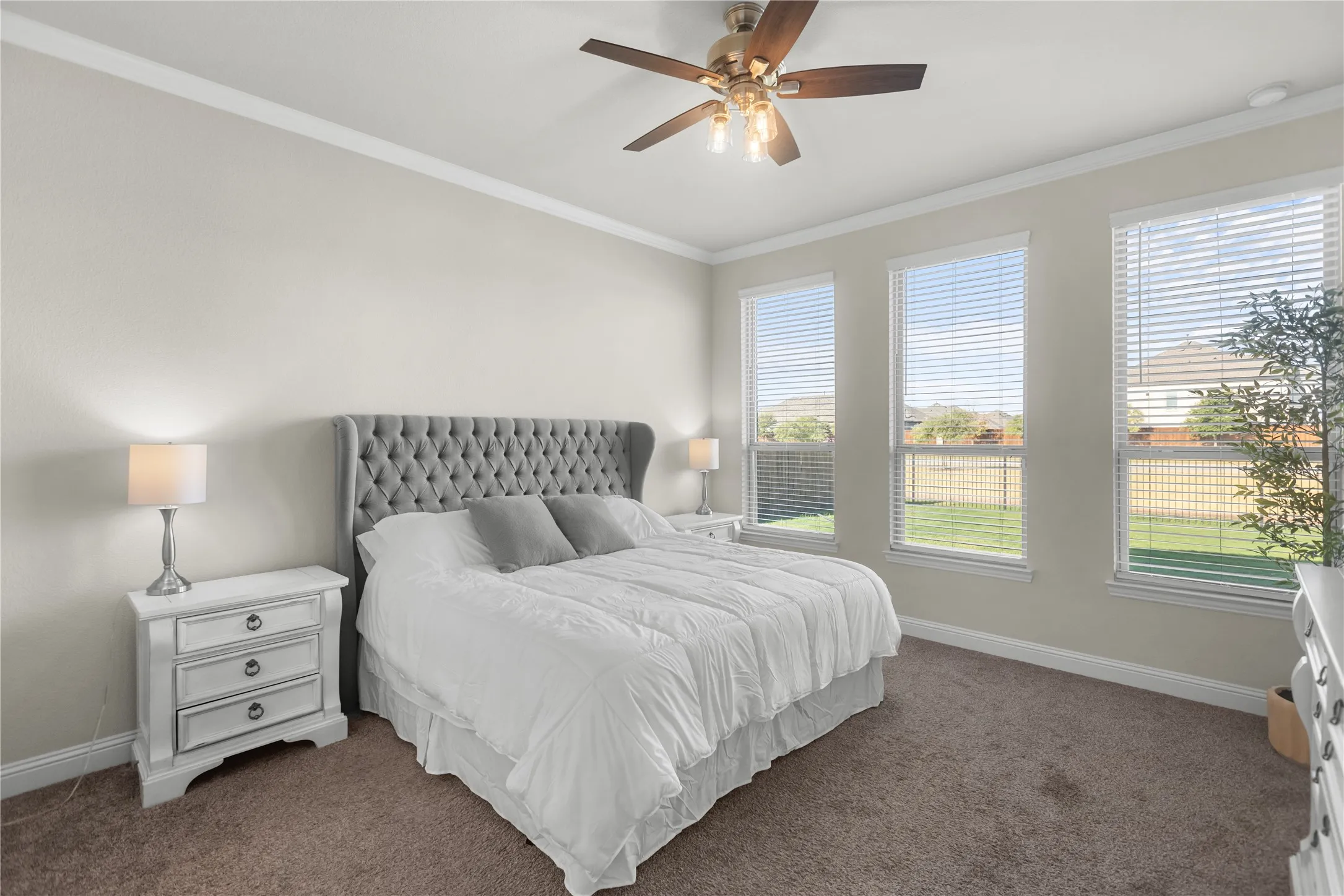 Primary bedroom tucked away on the first floor for privacy, tons of natural lighting.