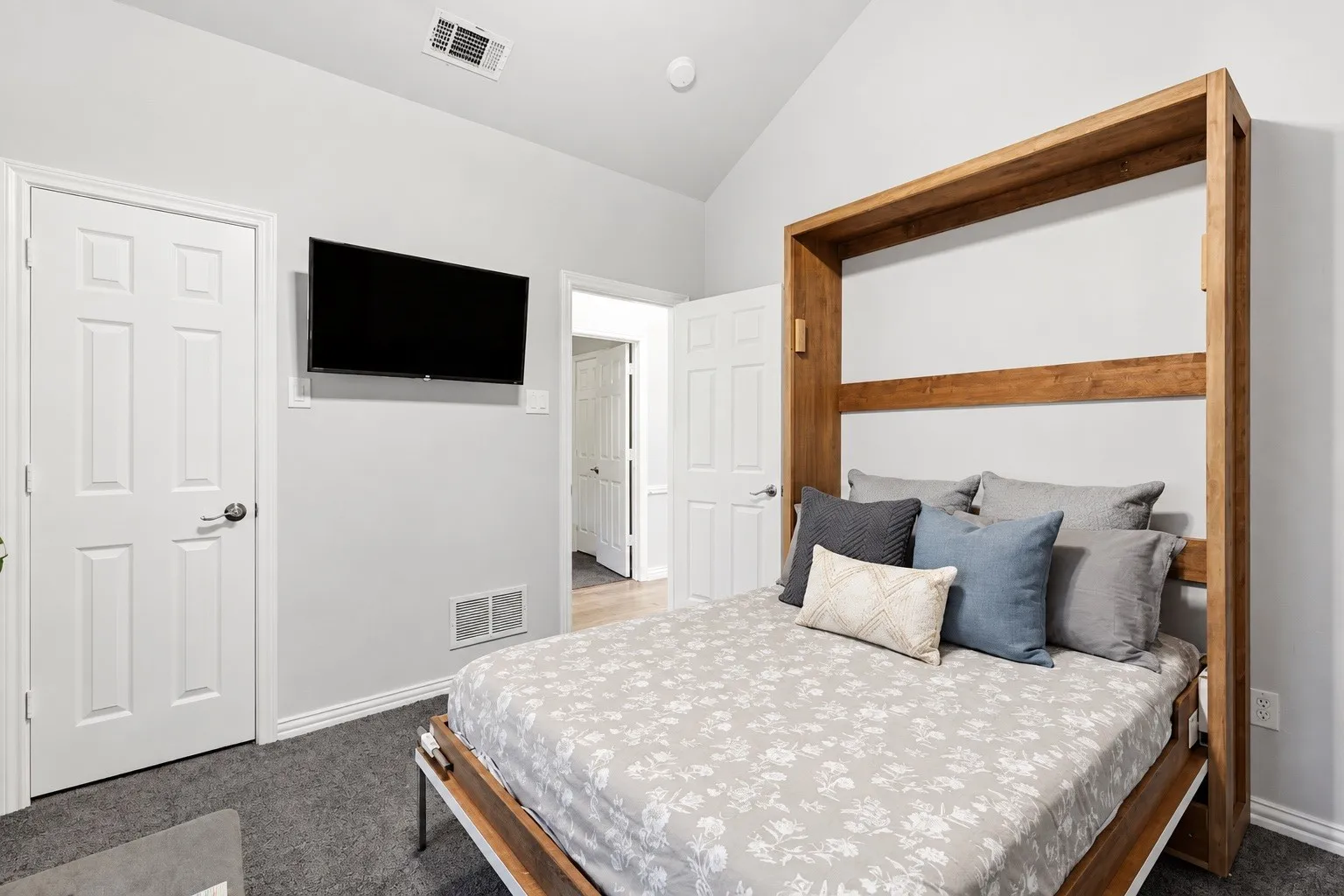 Third bedroom with vaulted ceilings, carpeted floors, a ceiling fan, closet, and window facing the front yard/street area (not in photo)