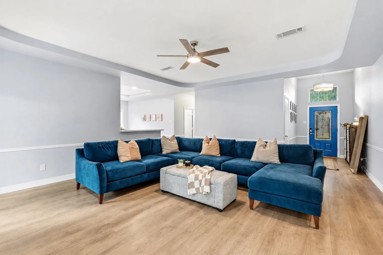 Entryway flows into the open concept living space, with beautiful moulding detail throughout