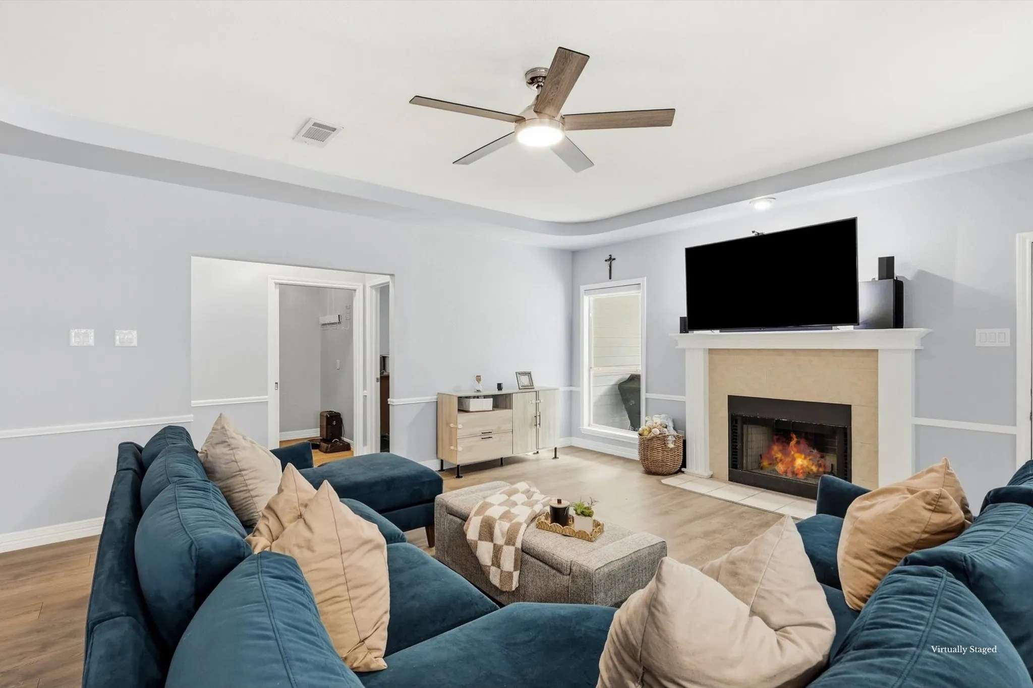 Gorgeous living room with primary suite, laundry, and garage off to the side