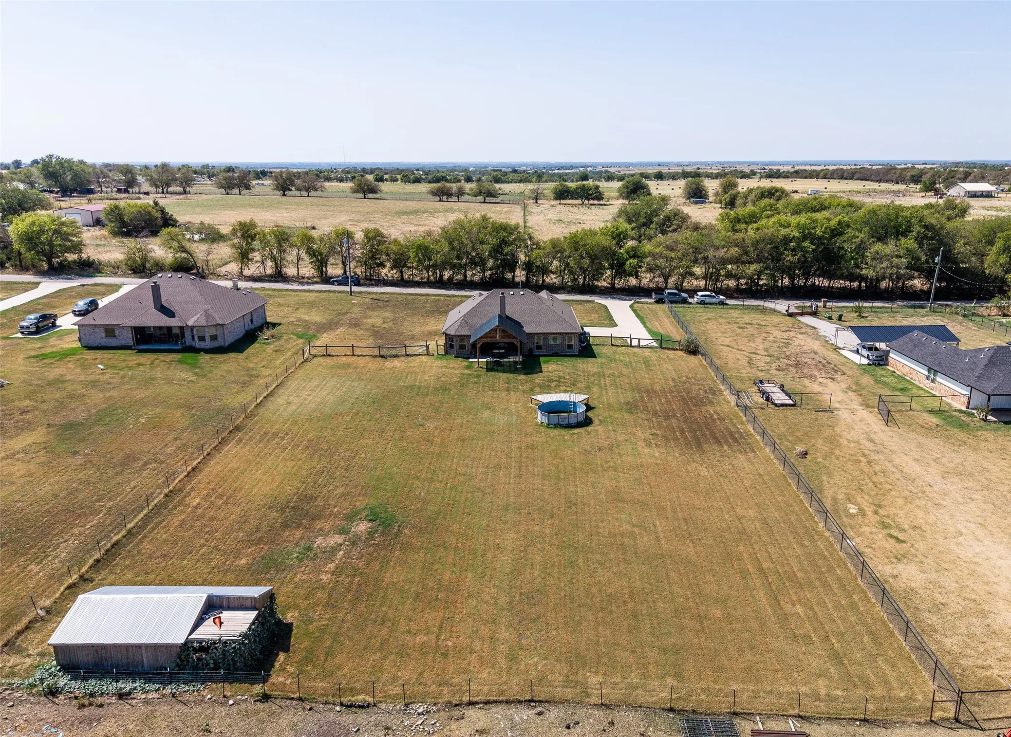View of the back of the home and the back yard.