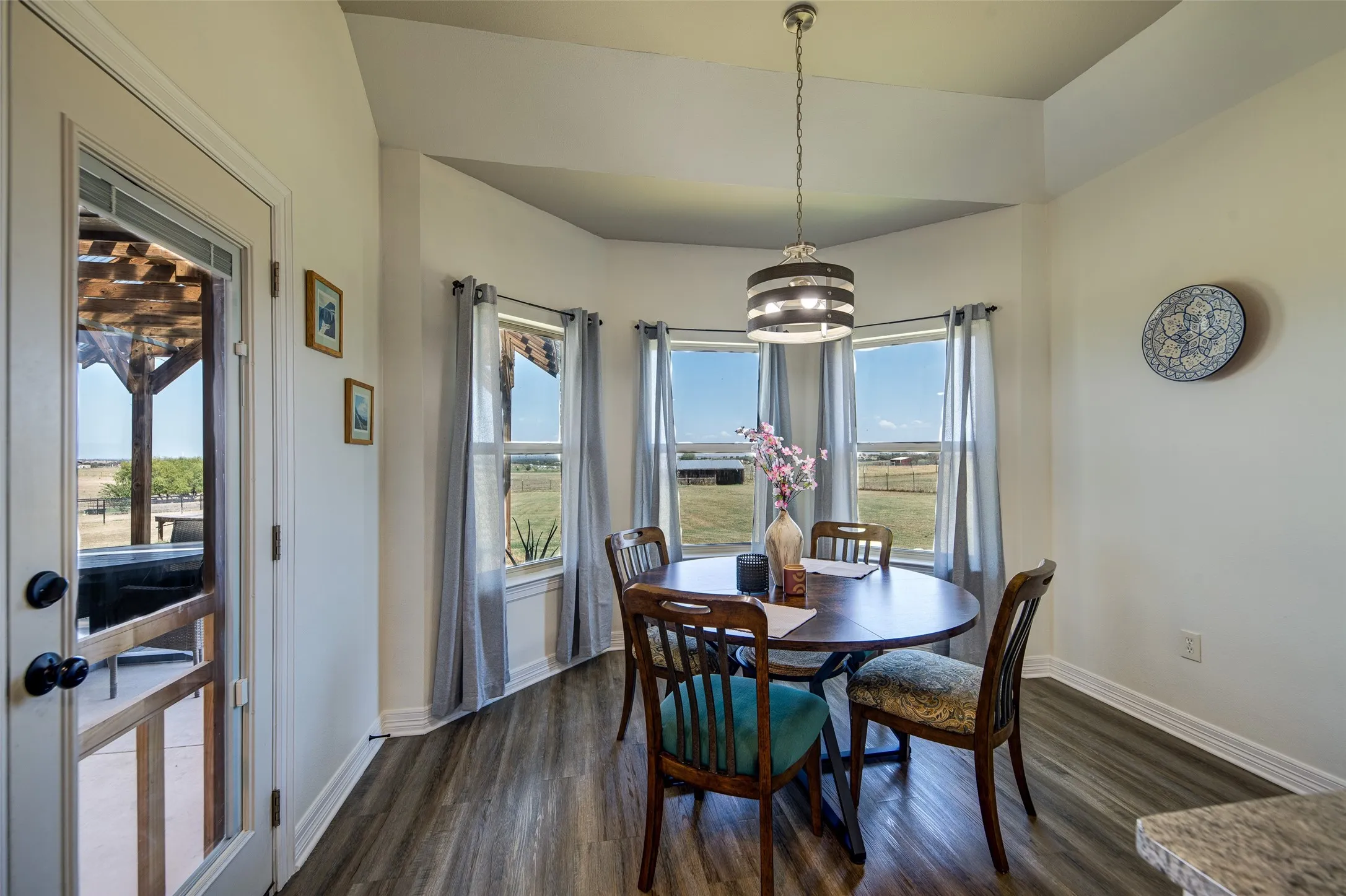 Breakfast area with bay window and view of the back yard.