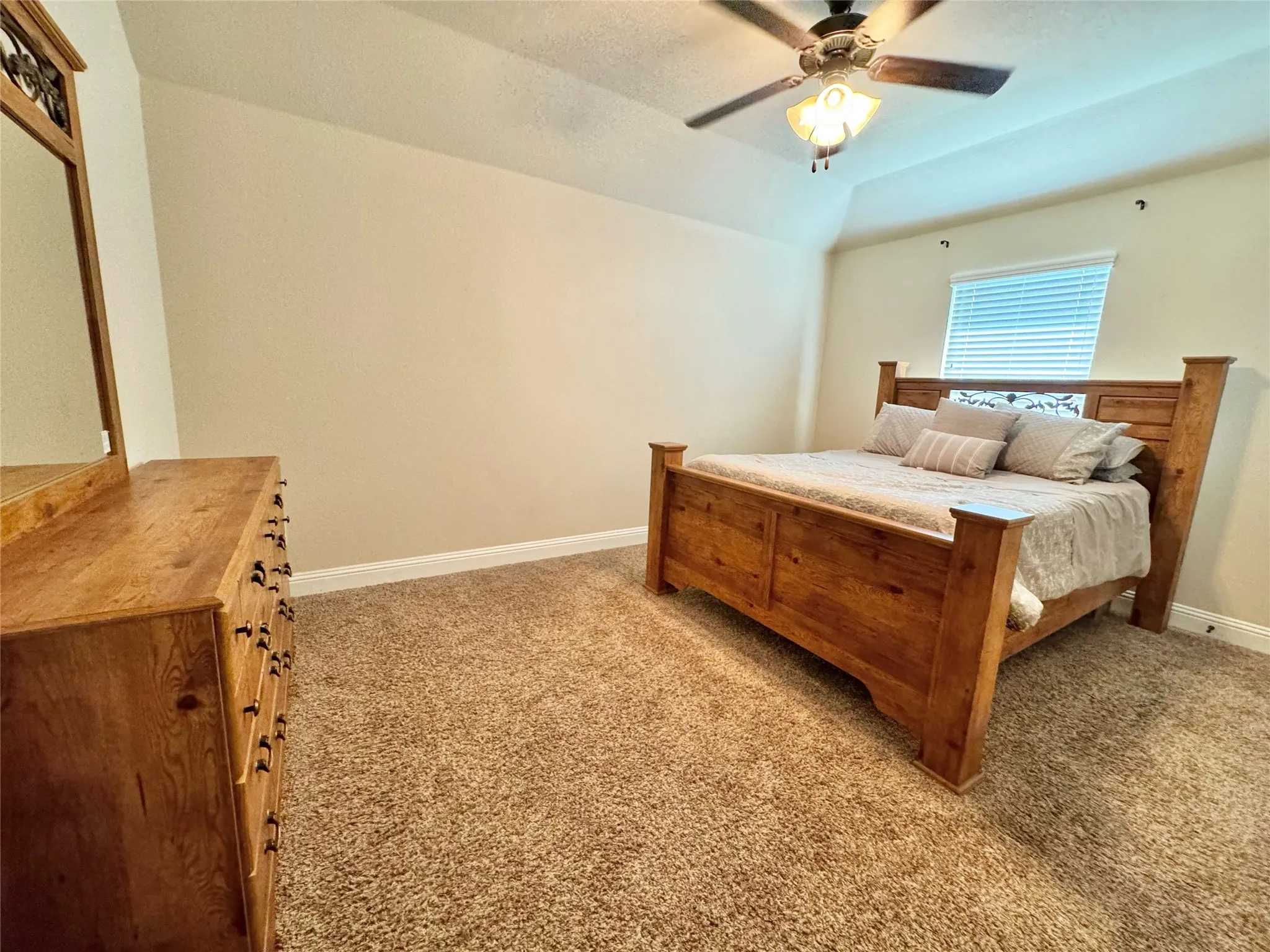 Bedroom featuring carpet flooring and ceiling fan