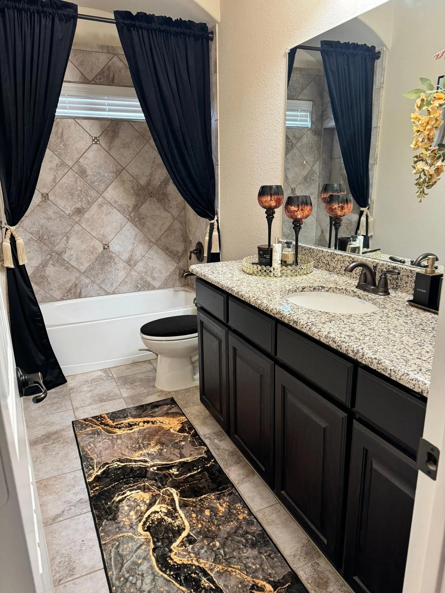 Full bathroom with toilet, vanity, tile patterned flooring, and shower / tub combo
