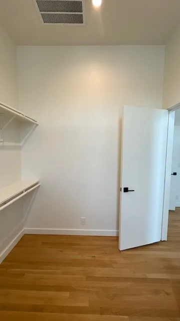 Primary Bedroom walk-in closet