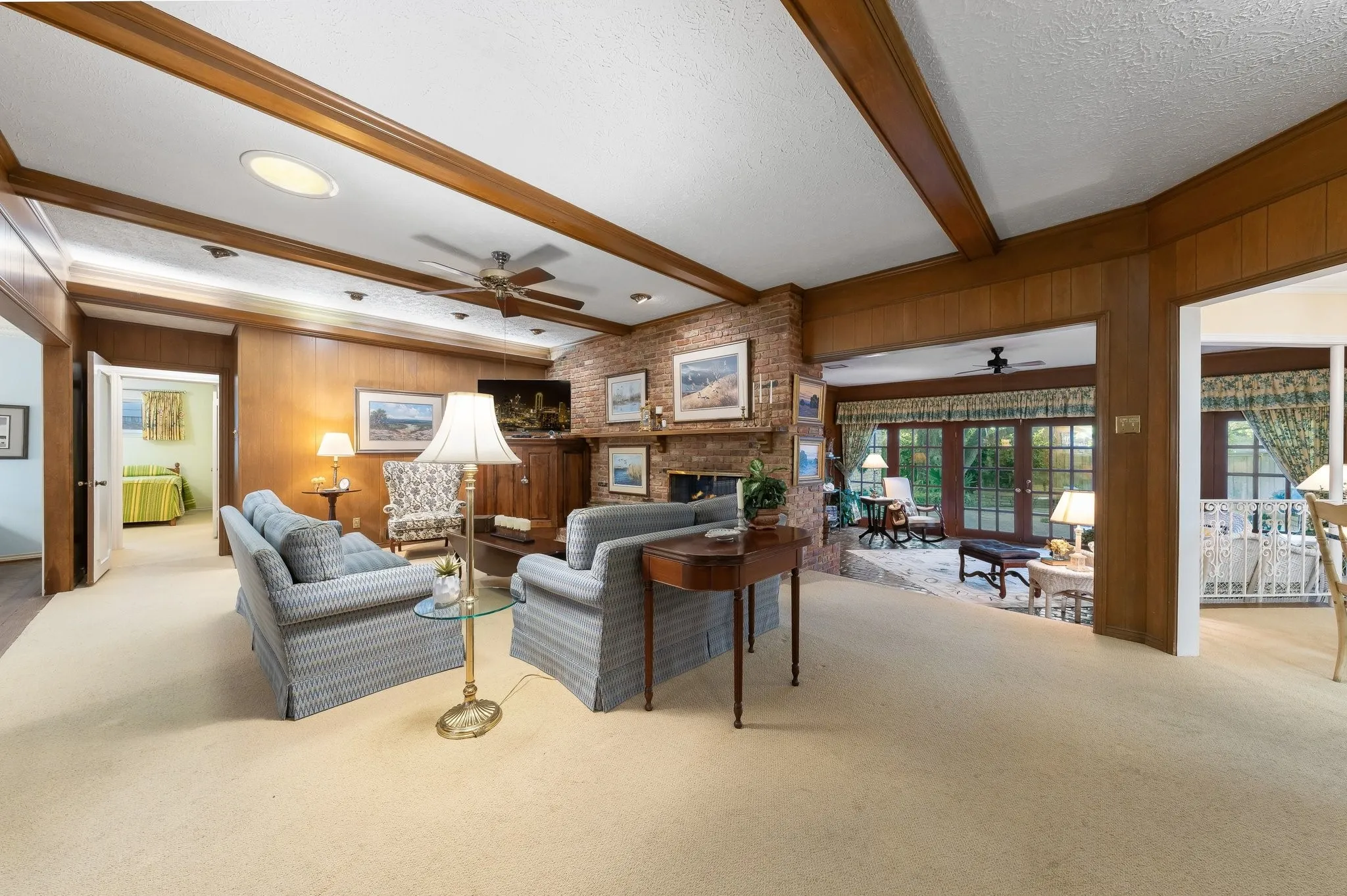 Family Room open to the Sun Room and Breakfast area.