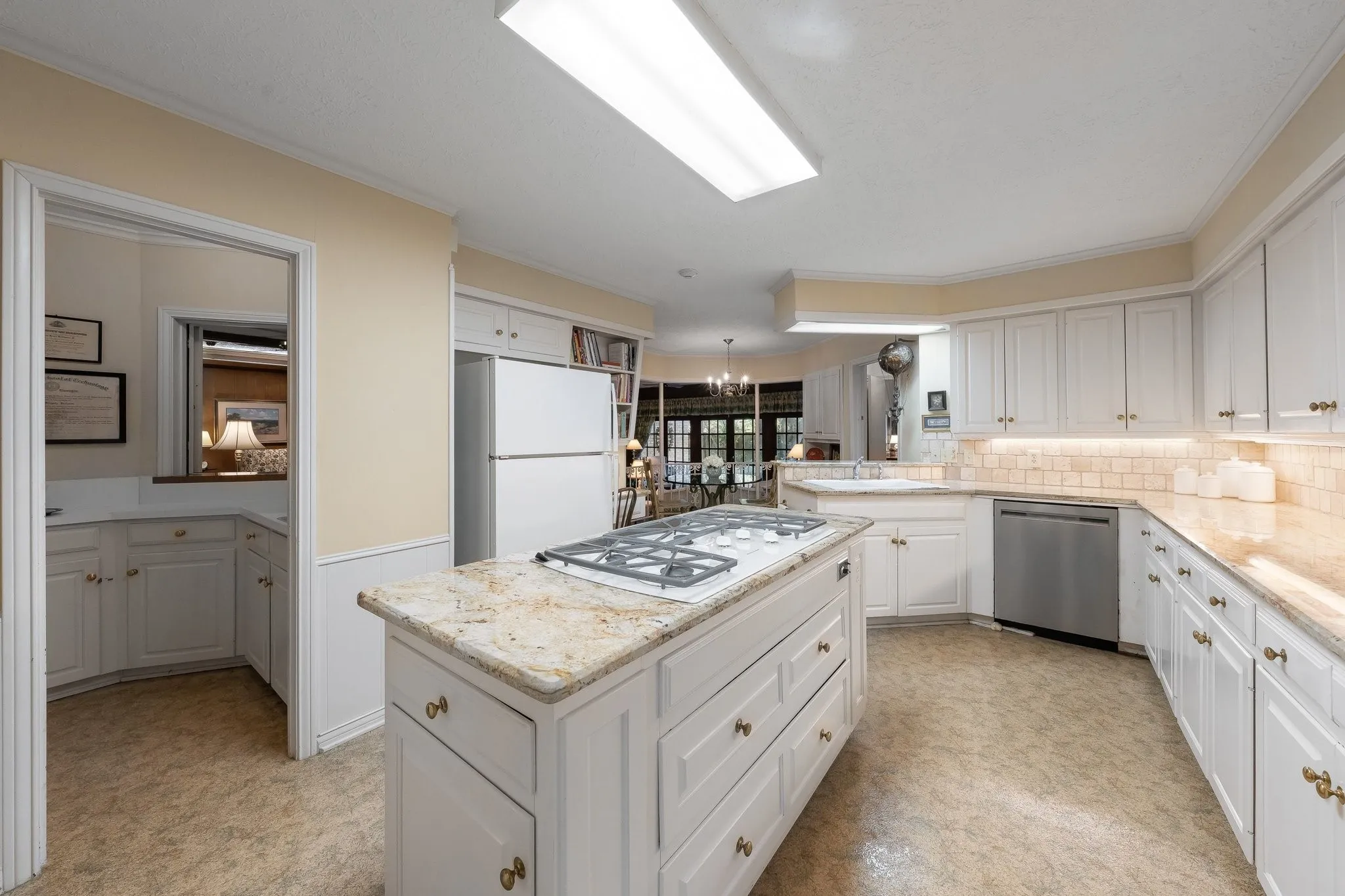 Wet Bar area off the kitchen with pass through window to the Family Room.
