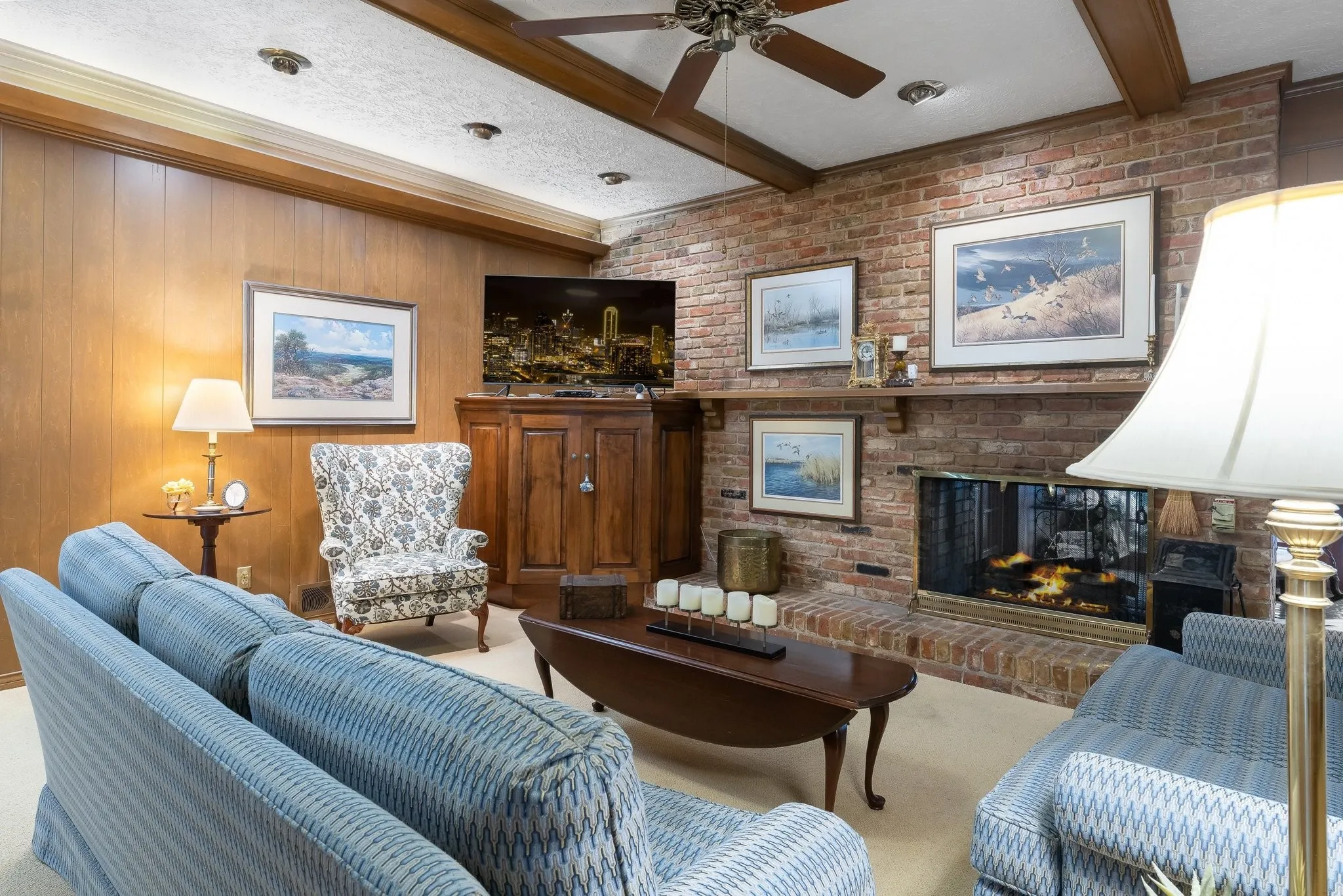 Brick wall fireplace see through to the Sun Room.