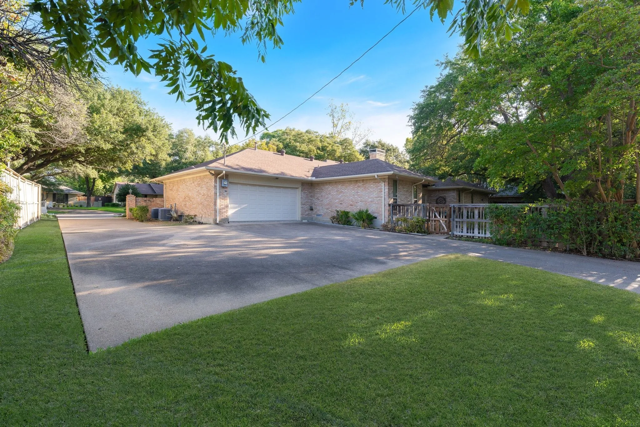 Drive way goes from front of home to Alley and garage can be entered both ways. Extra parking in front of home and back.