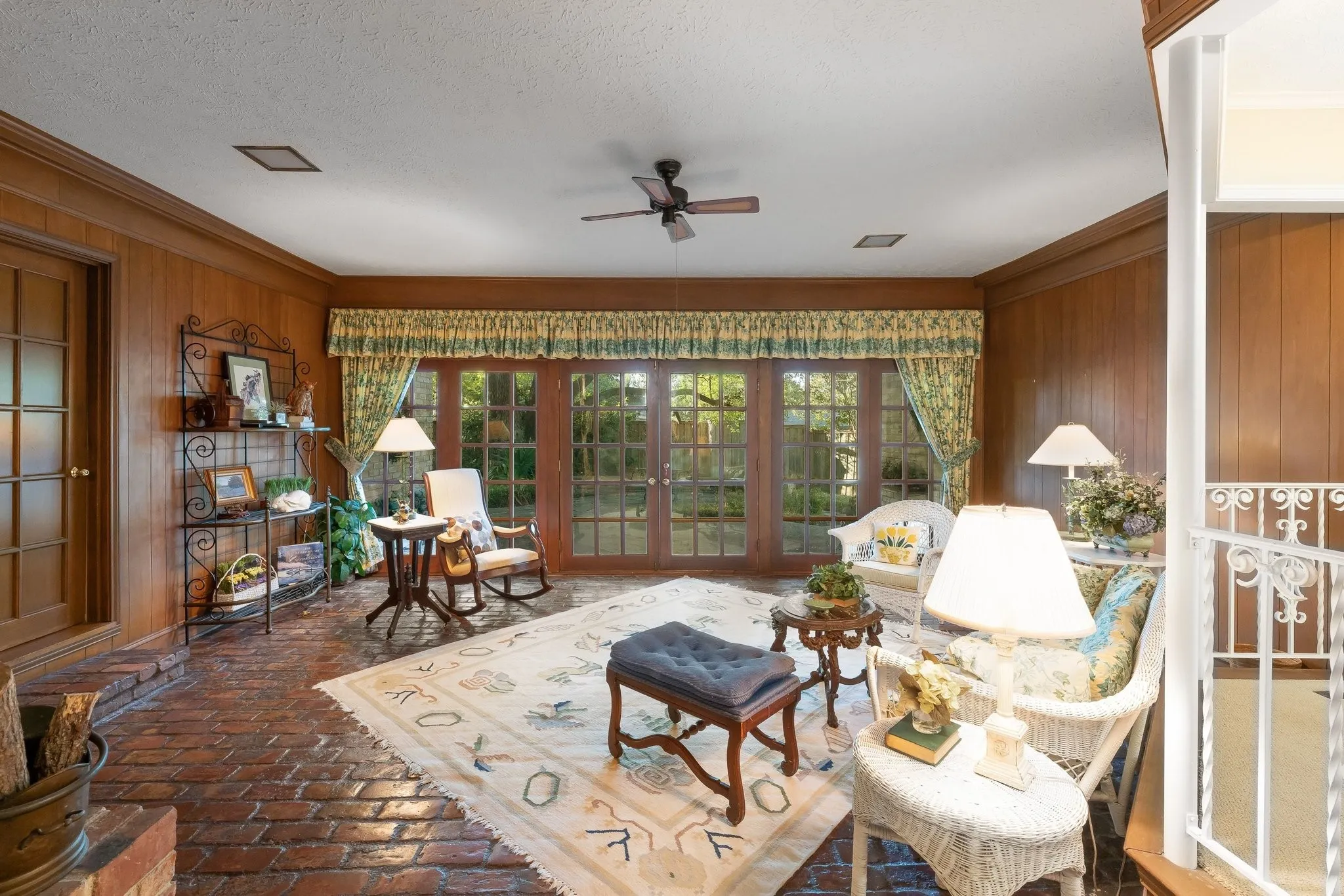 Sun Room with French Doors to back yard and patio area.