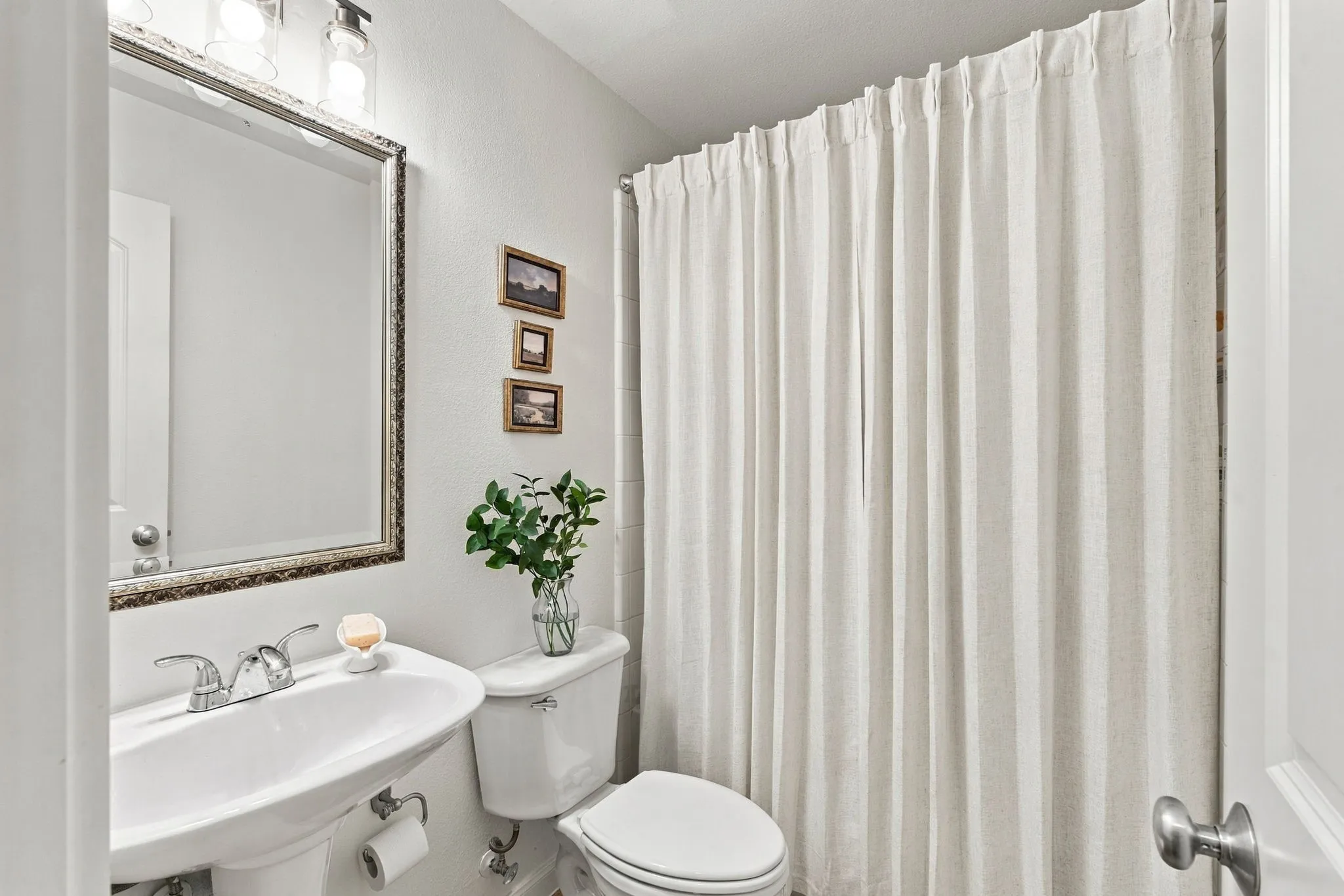 One of four FULL bathrooms two down and two up