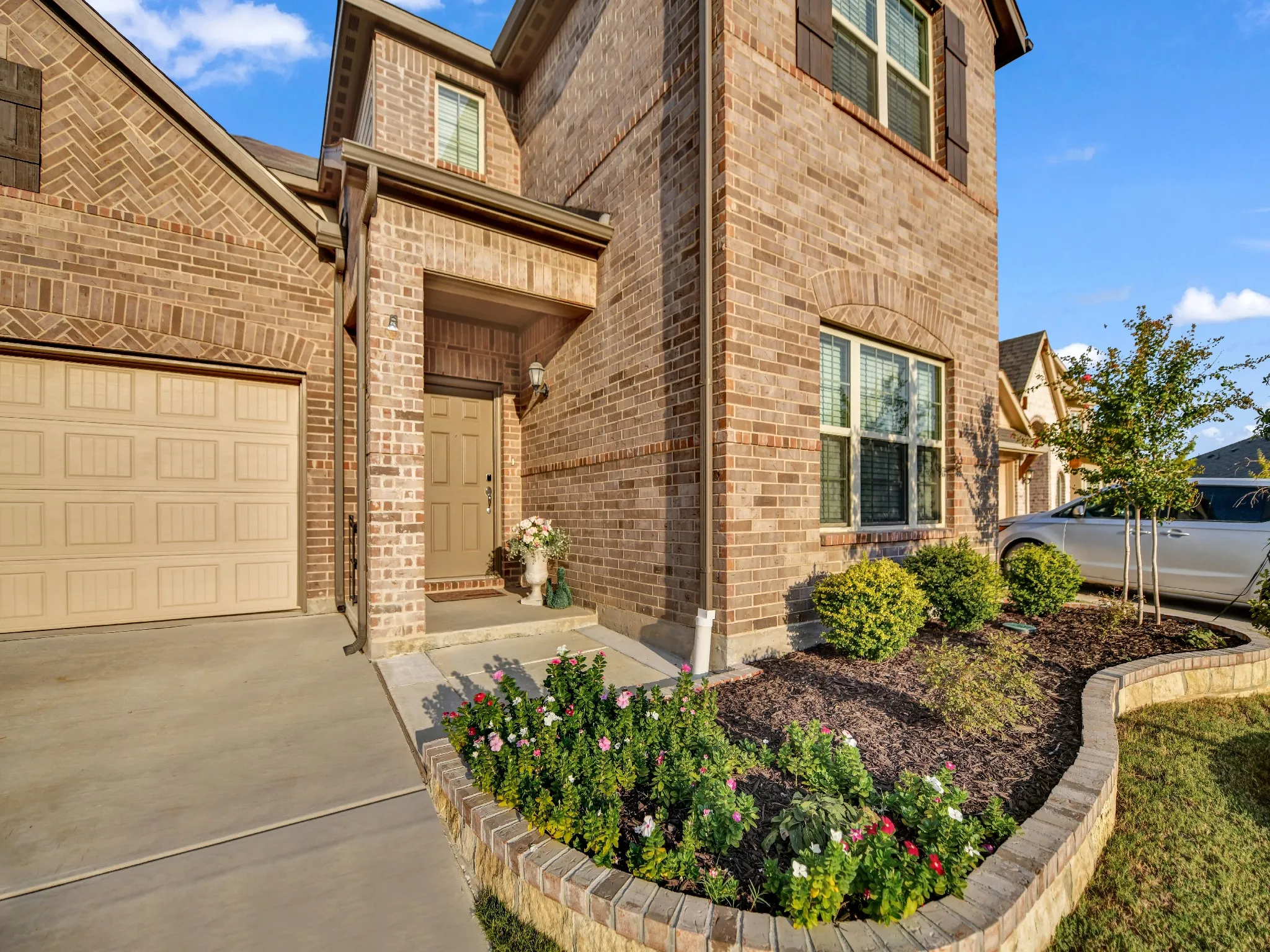 Landscaping with Brick and Stone Border added by current owner