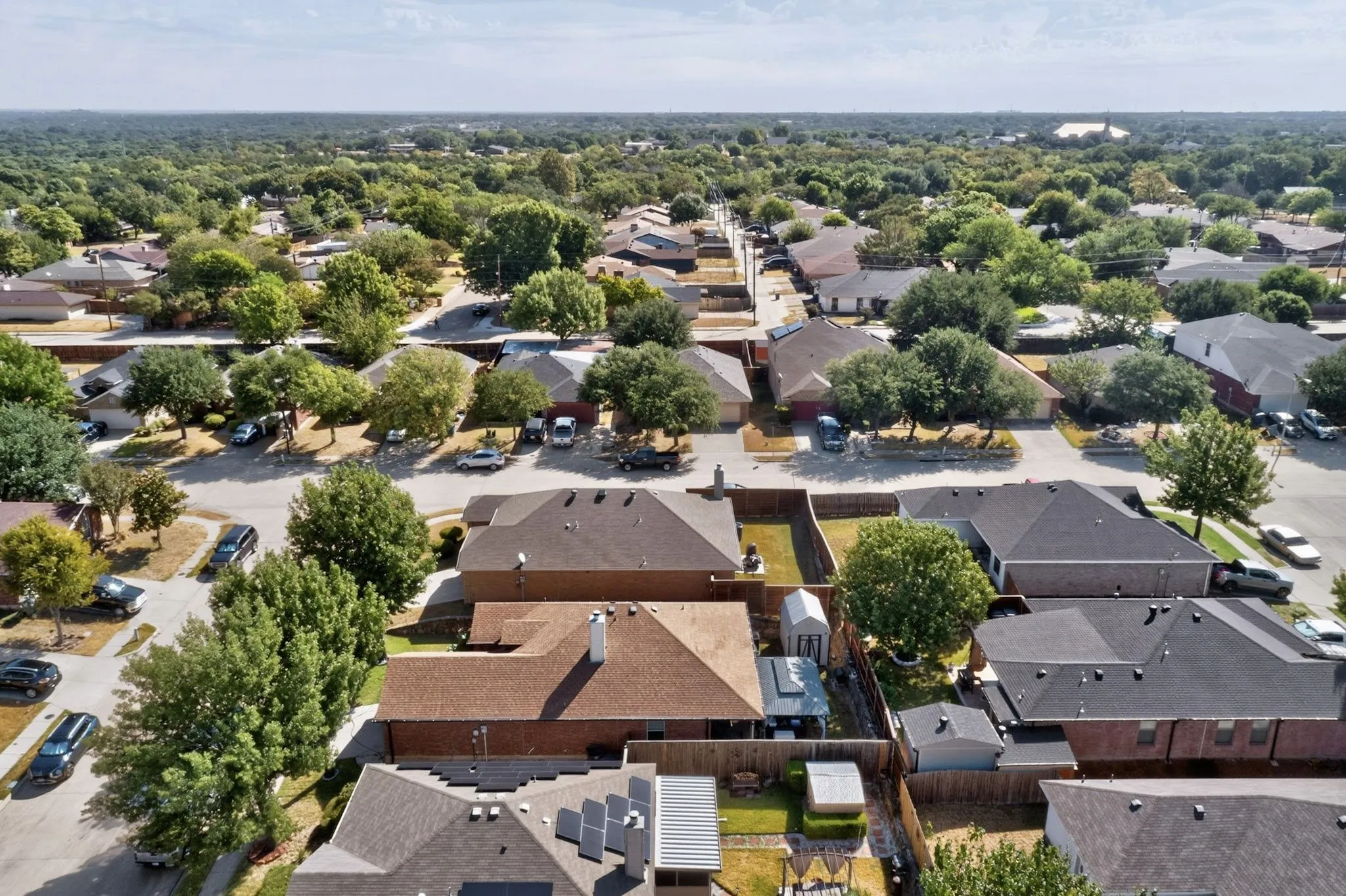 Residential neighborhood featuring mature trees and a consistent architectural style