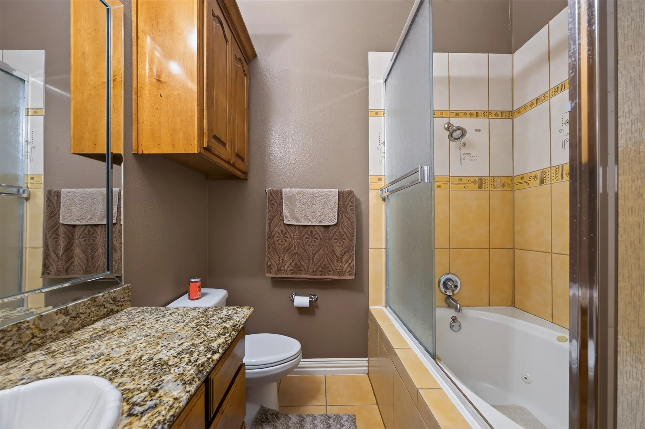 En suite bathroom with shower, tub. built-in cabinetry