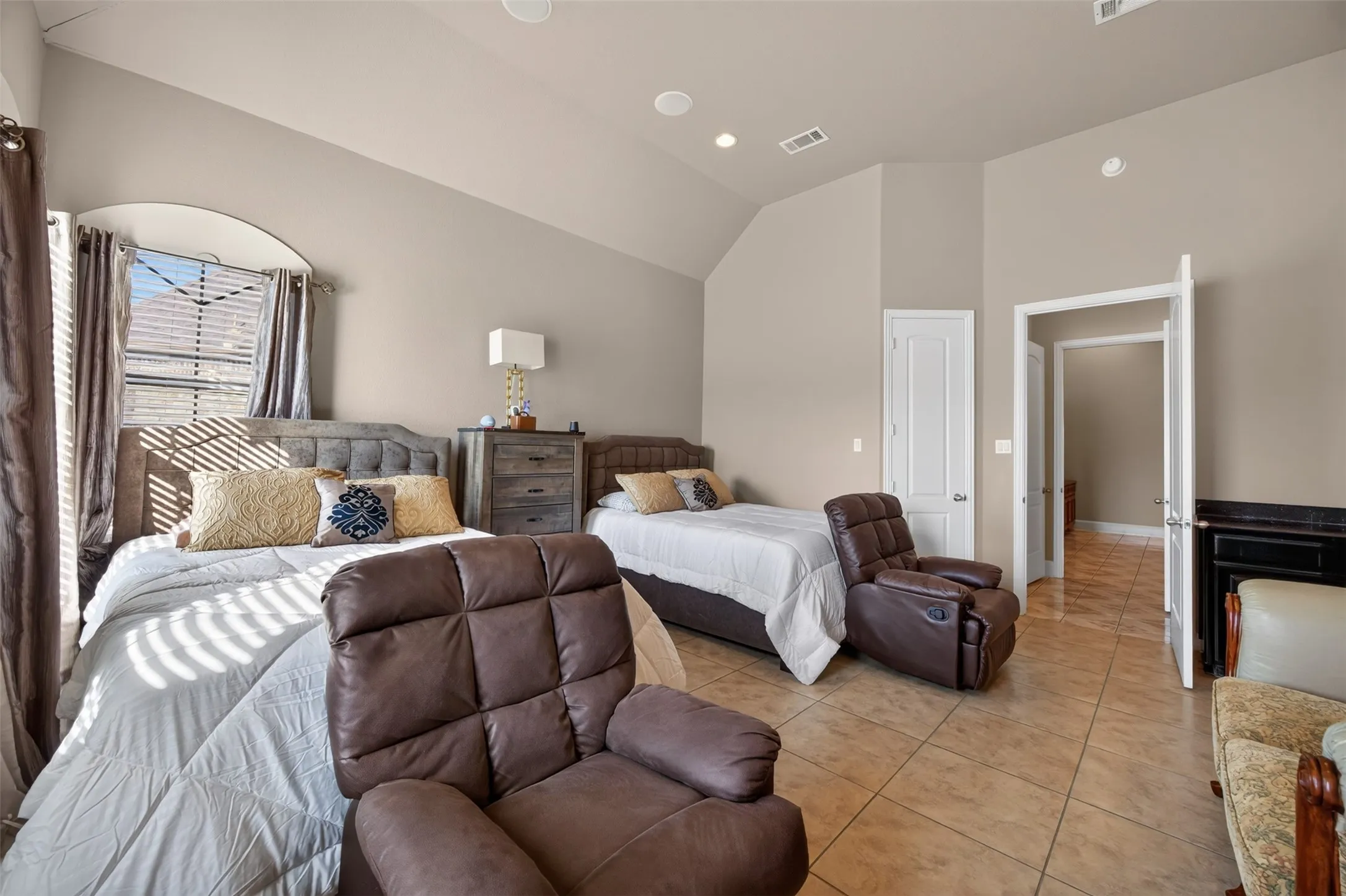 Bedroom with built-in desk and ensuite bathroom that could be a second primary bedroom