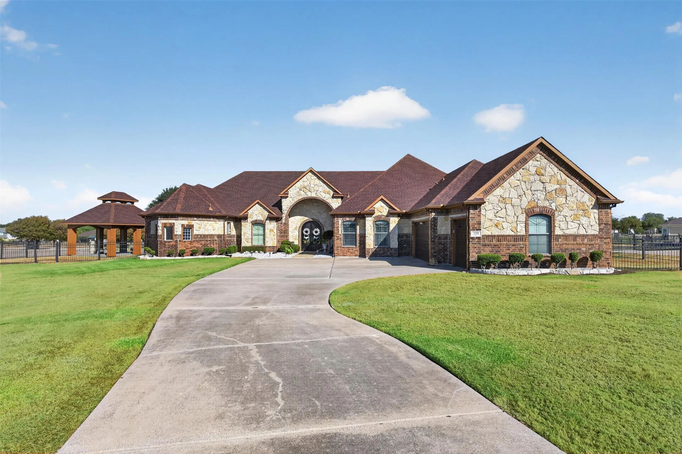 Front of home on 1+ acre lot with 3-car garage