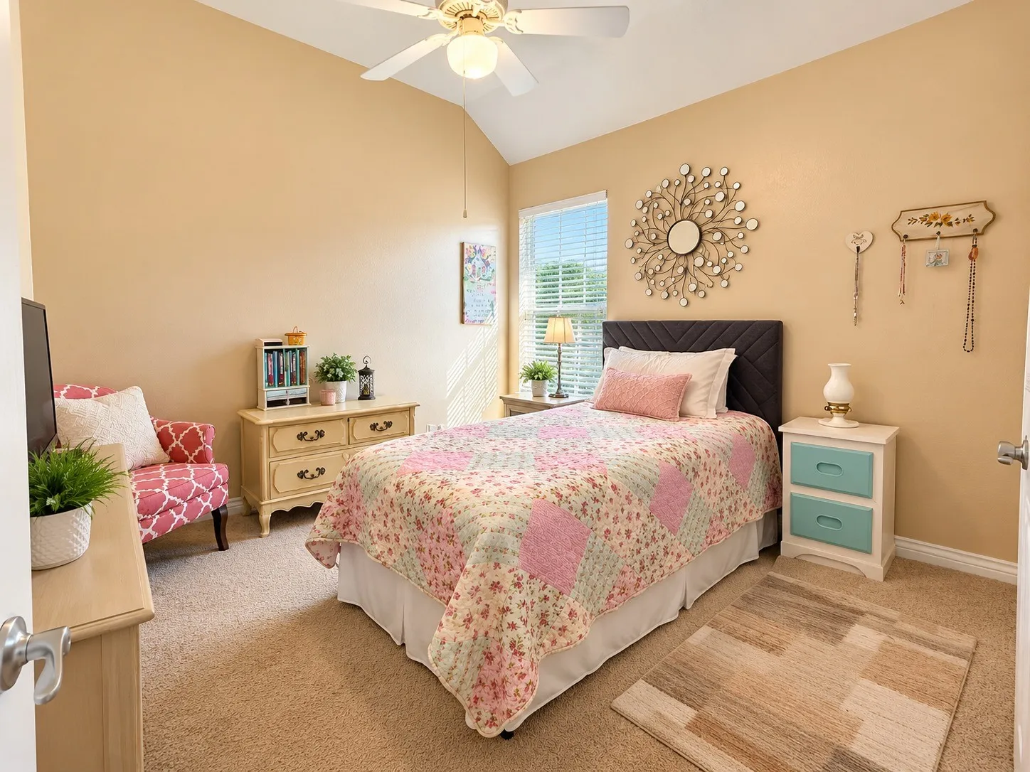 Vaulted ceiling with a ceiling fan, carpeted flooring, and a single window with blinds