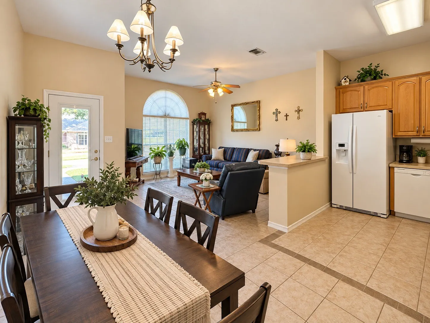 Open-concept living space featuring a dining area, living room, and kitchen