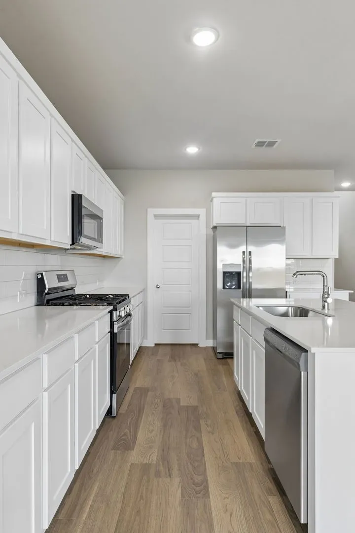 Kitchen in the Winters home plan by Trophy Signature Homes – REPRESENTATIVE PHOTO