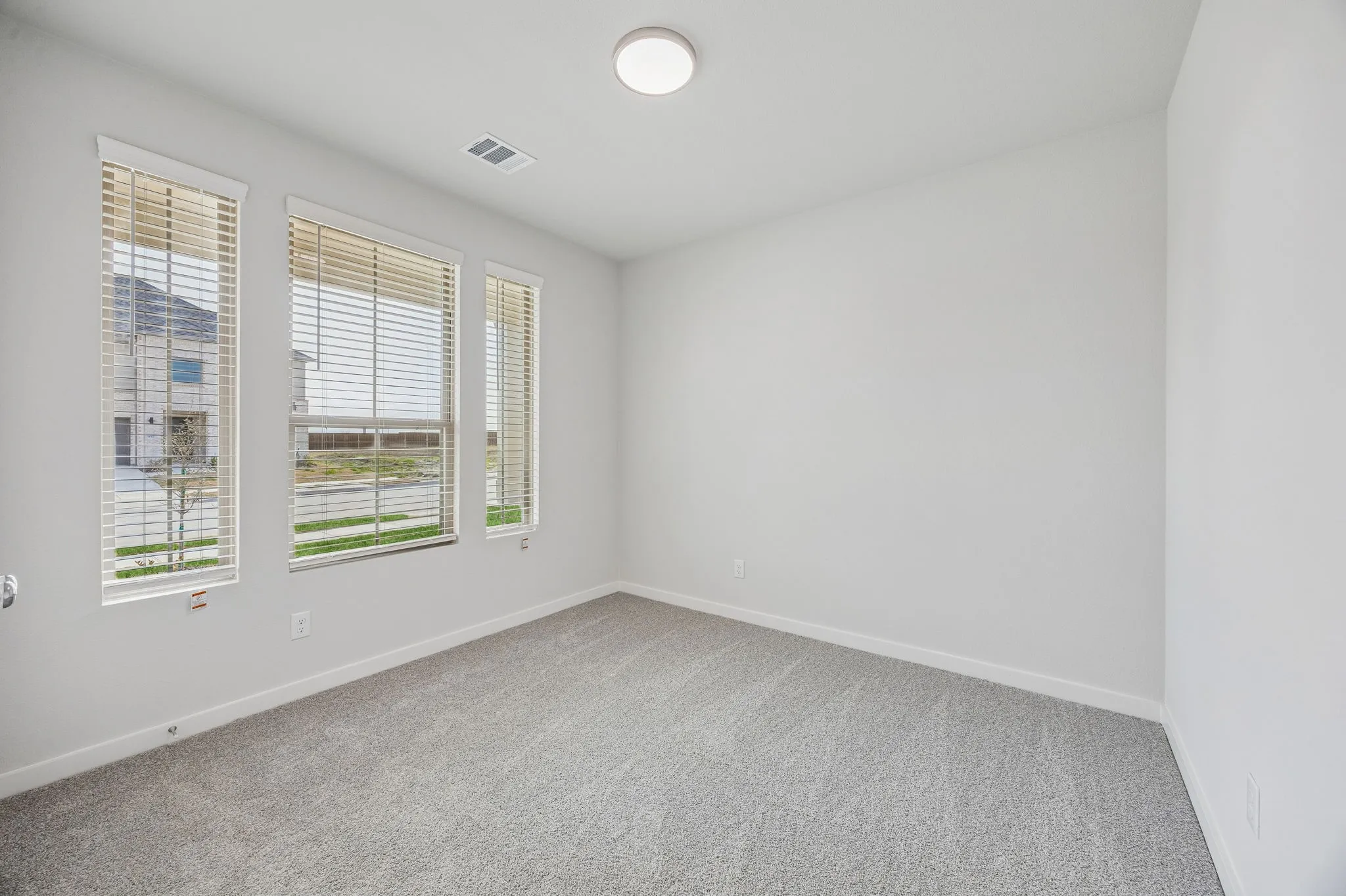 Bedroom in the Stanley II home plan by Trophy Signature Homes – REPRESENTATIVE PHOTO
