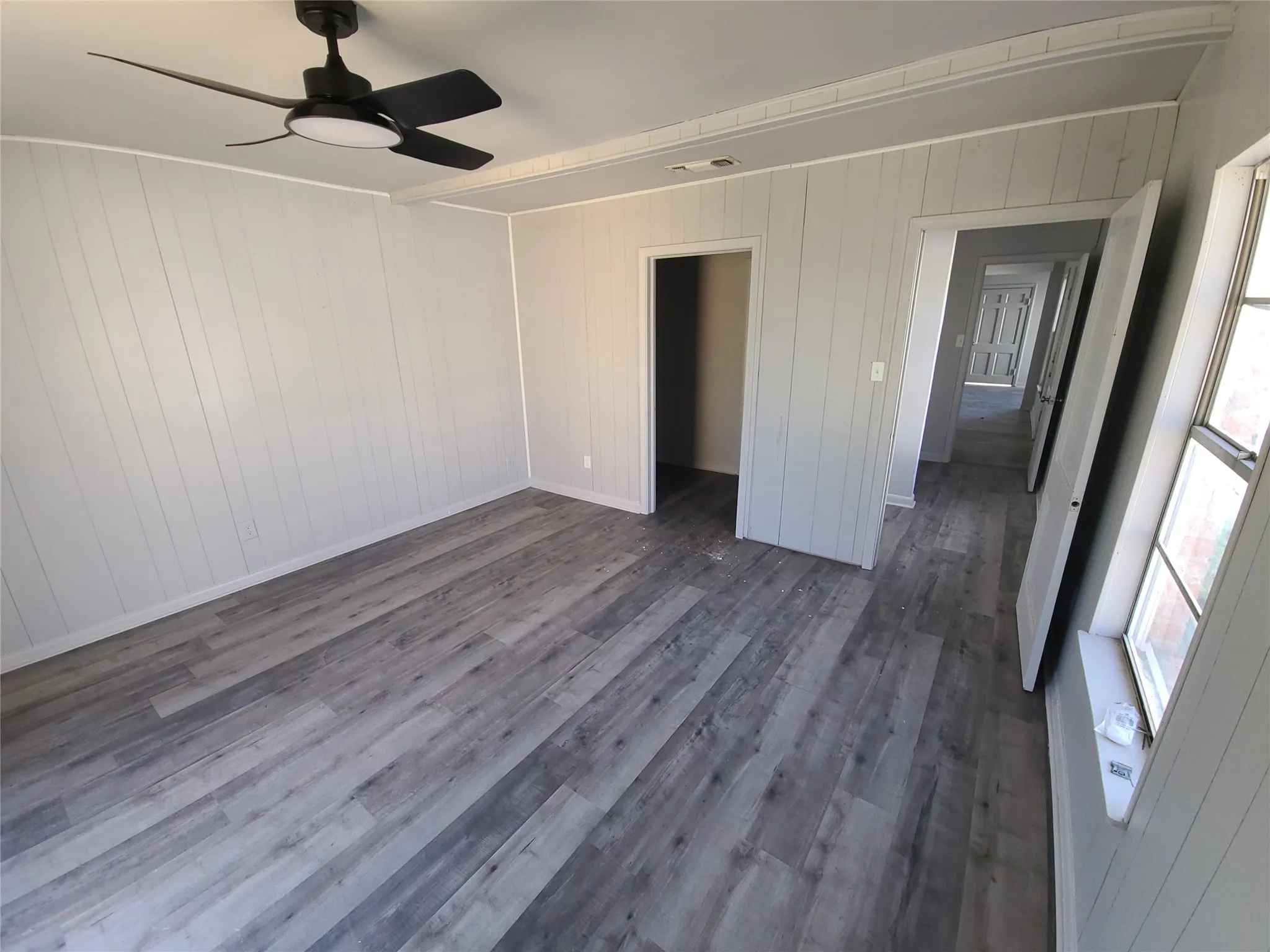 bedroom with large closets and private bathroom.